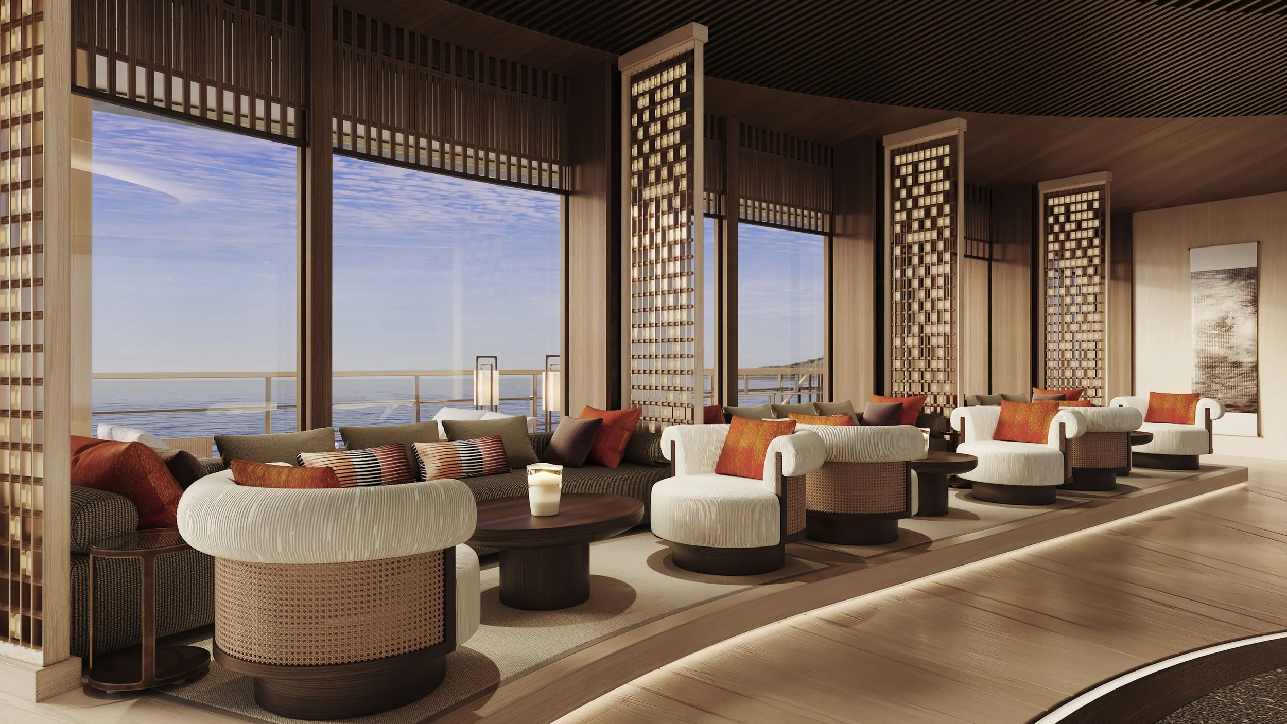 Interior of a modern lounge with large windows overlooking water, featuring beige and dark wood furniture, colorful cushions, and decorative sliding wood panels.