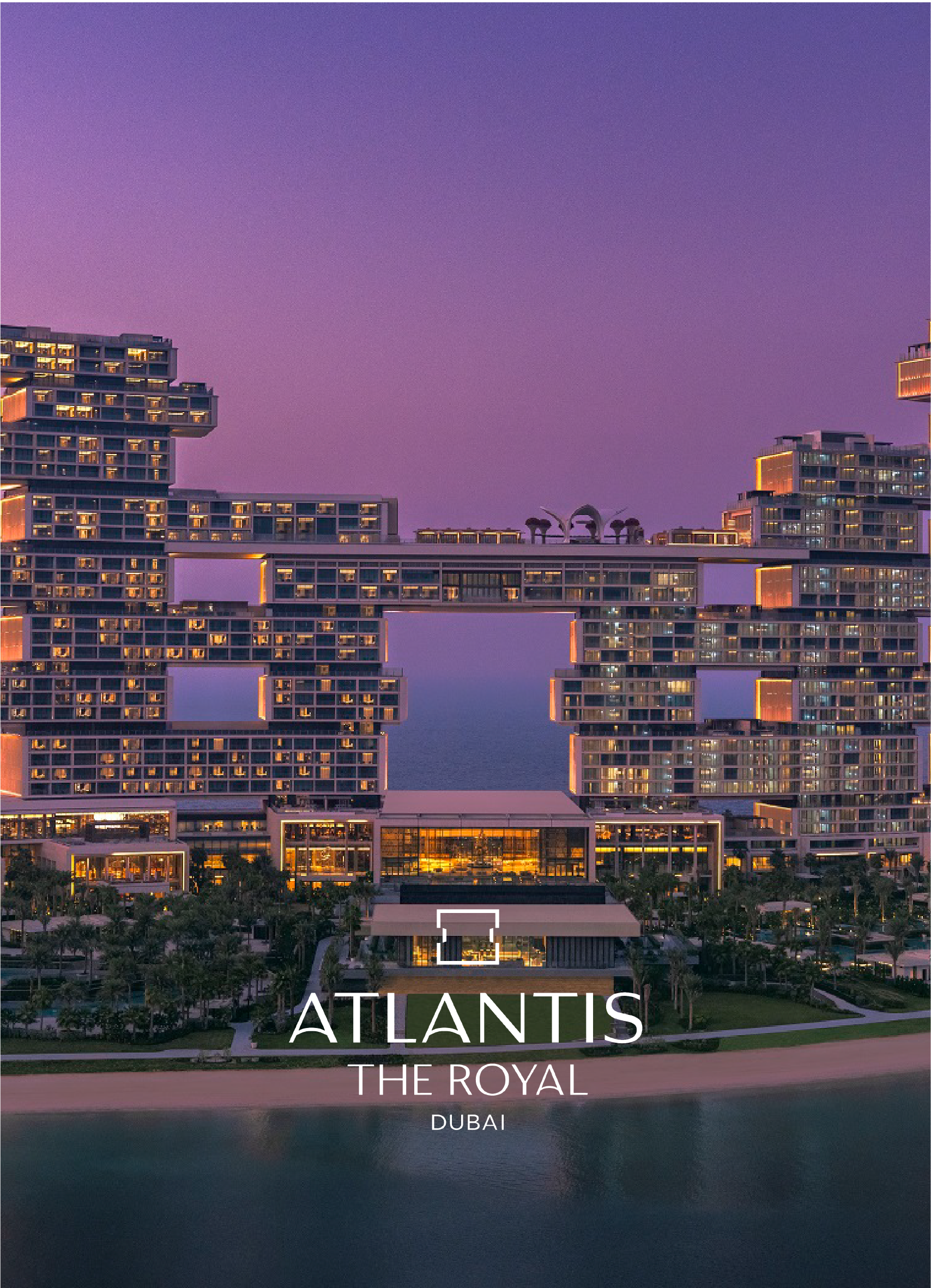 Aerial view of Atlantis The Royal hotel in Dubai with a purple sky background and water reflection in the foreground.