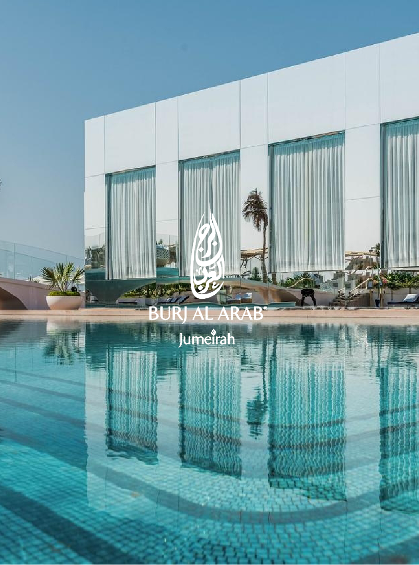 Modern hotel with a swimming pool, glass exterior, white curtains, and a palm tree in Dubai.