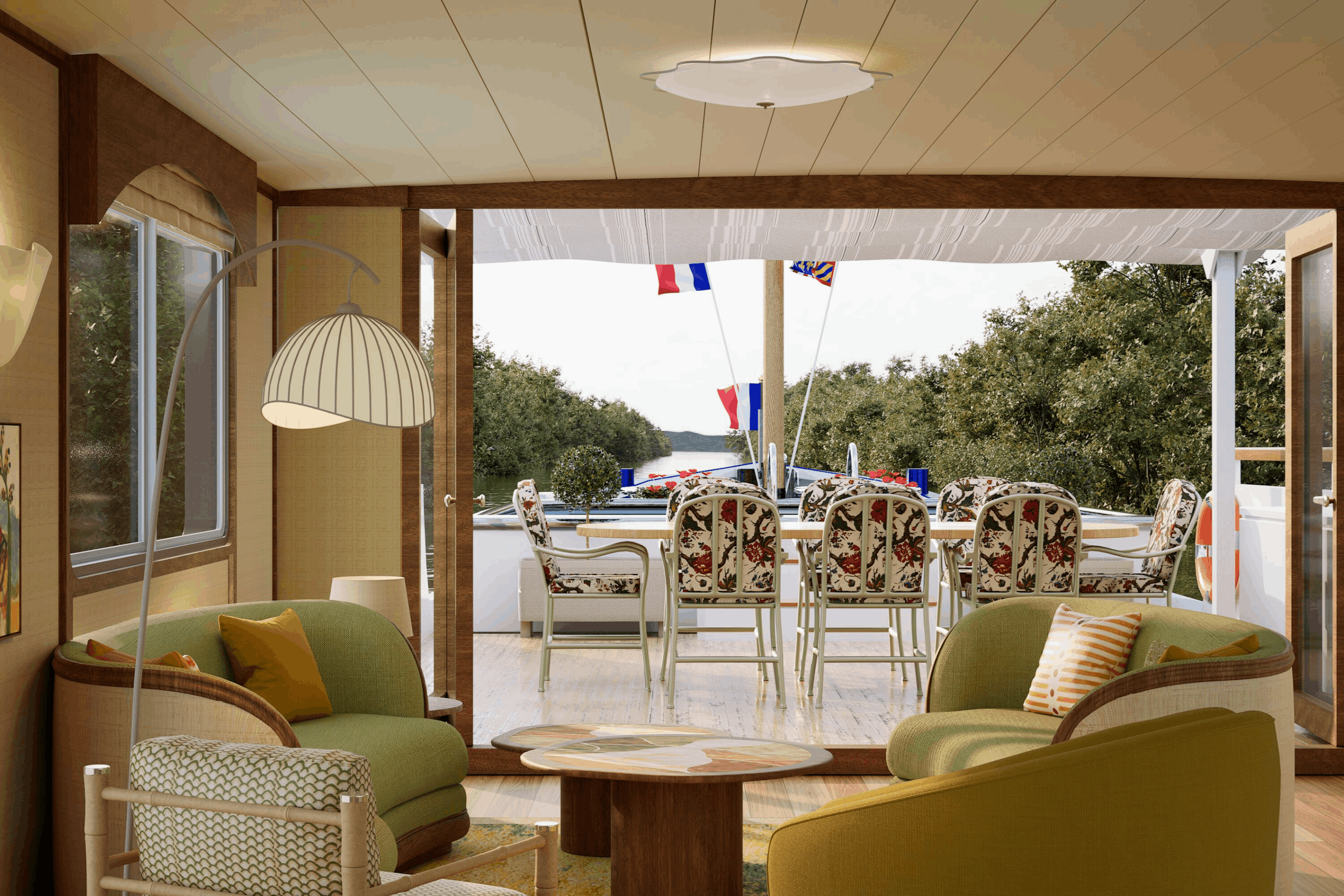 Indoor room with green armchairs, a wooden coffee table, and standing lamp. Open sliding door reveals outdoor patio with dining table, chairs, flags, and water view