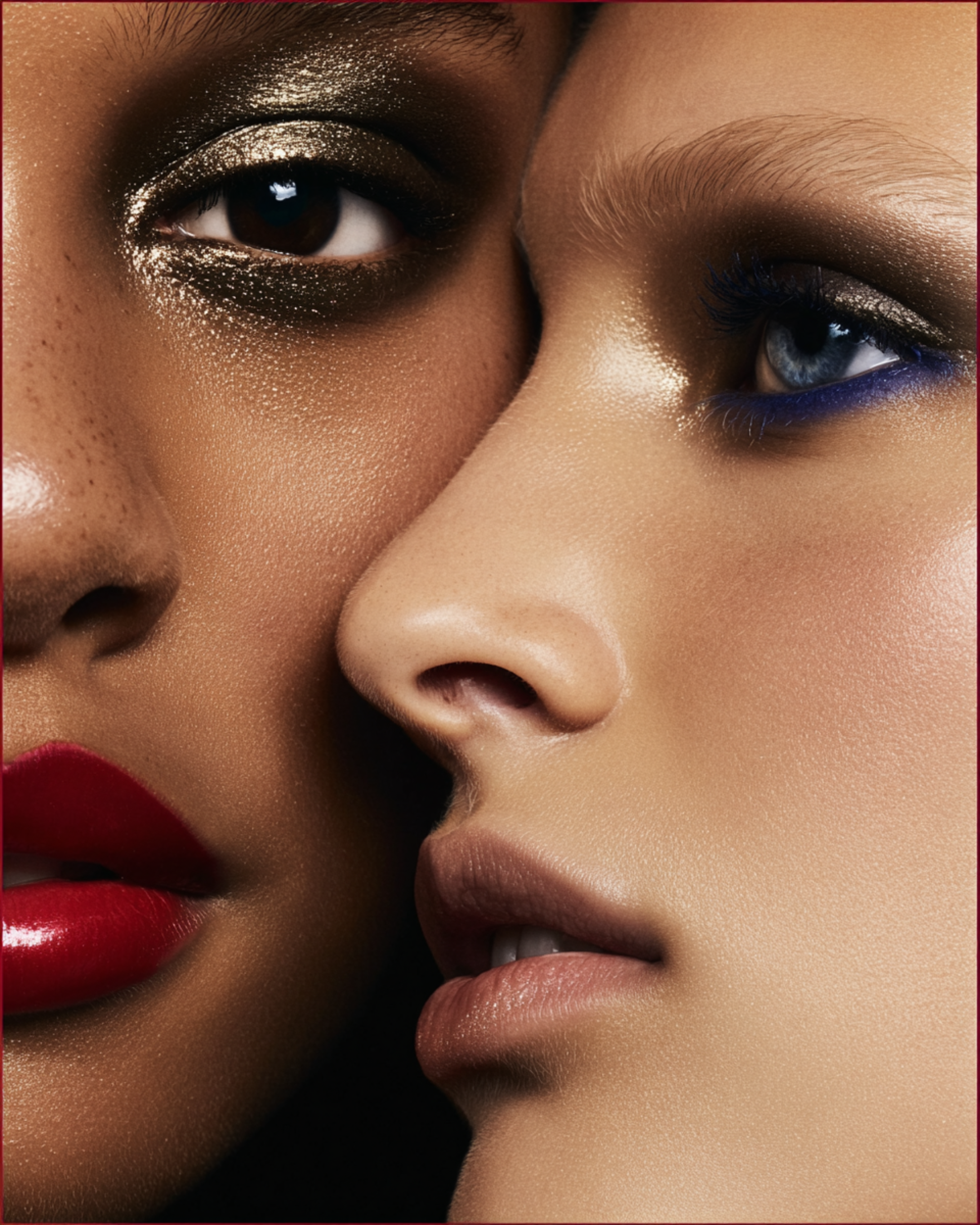 Close-up image of two women with contrasting skin tones, one with dark skin and the other with light skin. They both have makeup on, including eye makeup and lipstick, and are positioned closely together, showcasing their faces.
