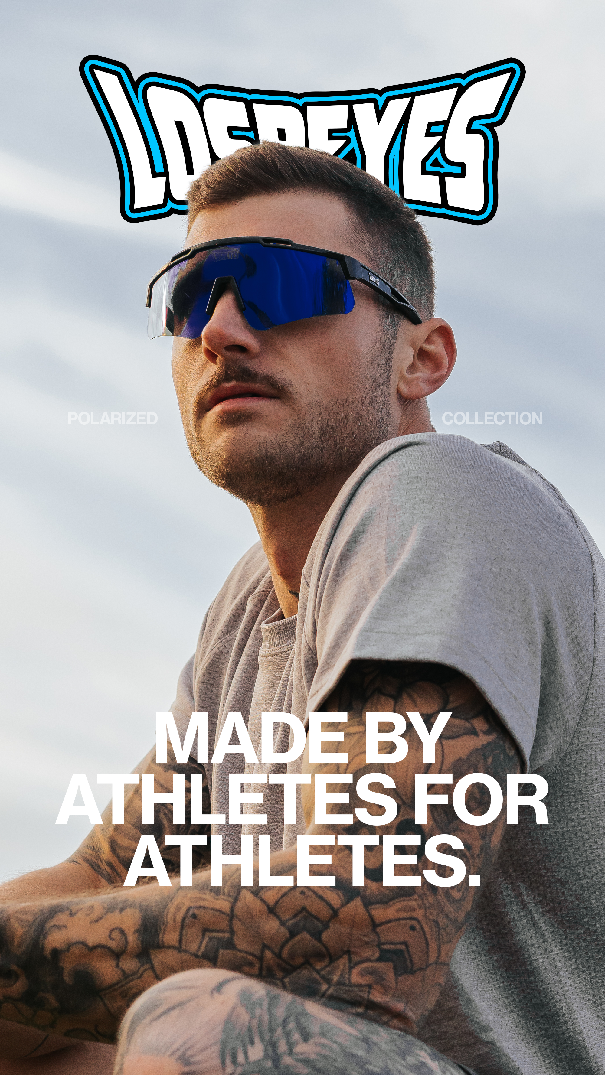 A young male athlete with short hair and sunglasses, sitting outdoors with cloudy sky in background. He has tattoos on his arm. Overlaid text reads: "Made by Athletes for Athletes."