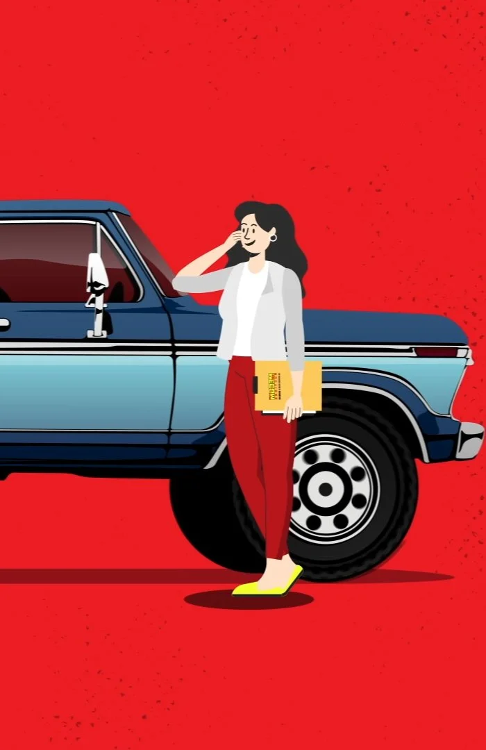 A woman standing next to a vintage blue pickup truck, holding yellow folders, wearing a white blazer, white shirt, red pants, and yellow shoes, on a red background.