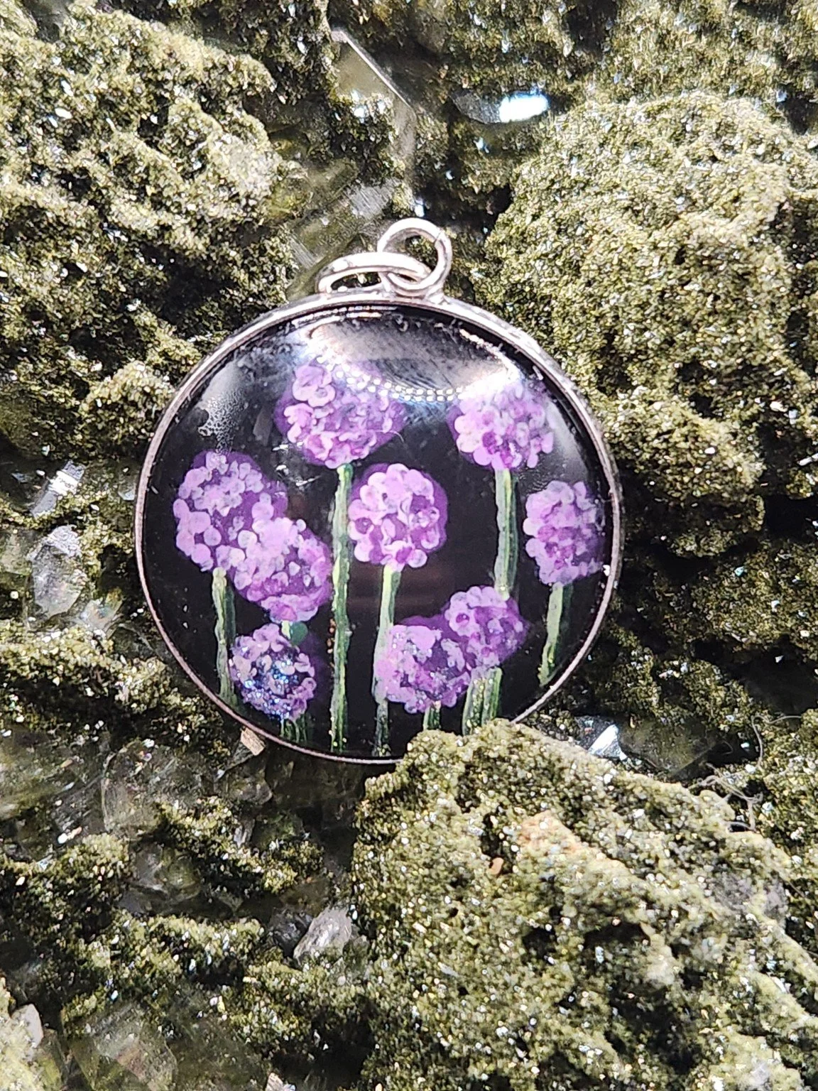 Allium flower pendant on a crystal display; display not included.