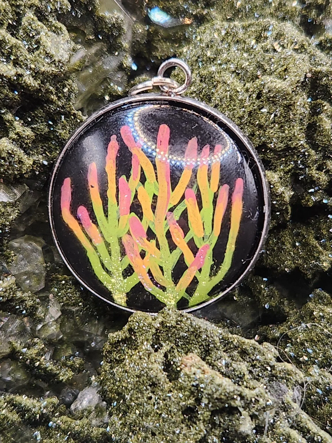 Firestick cactus art pendant displayed among green crystals. Crystal display and styling props not included.