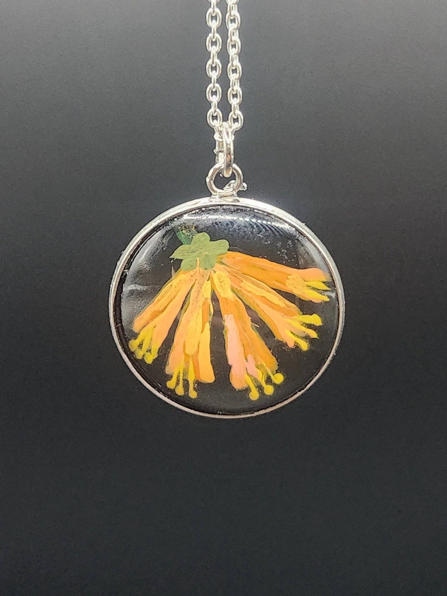 Honeysuckle art pendant on a display chain. Pendant only; chain not included.