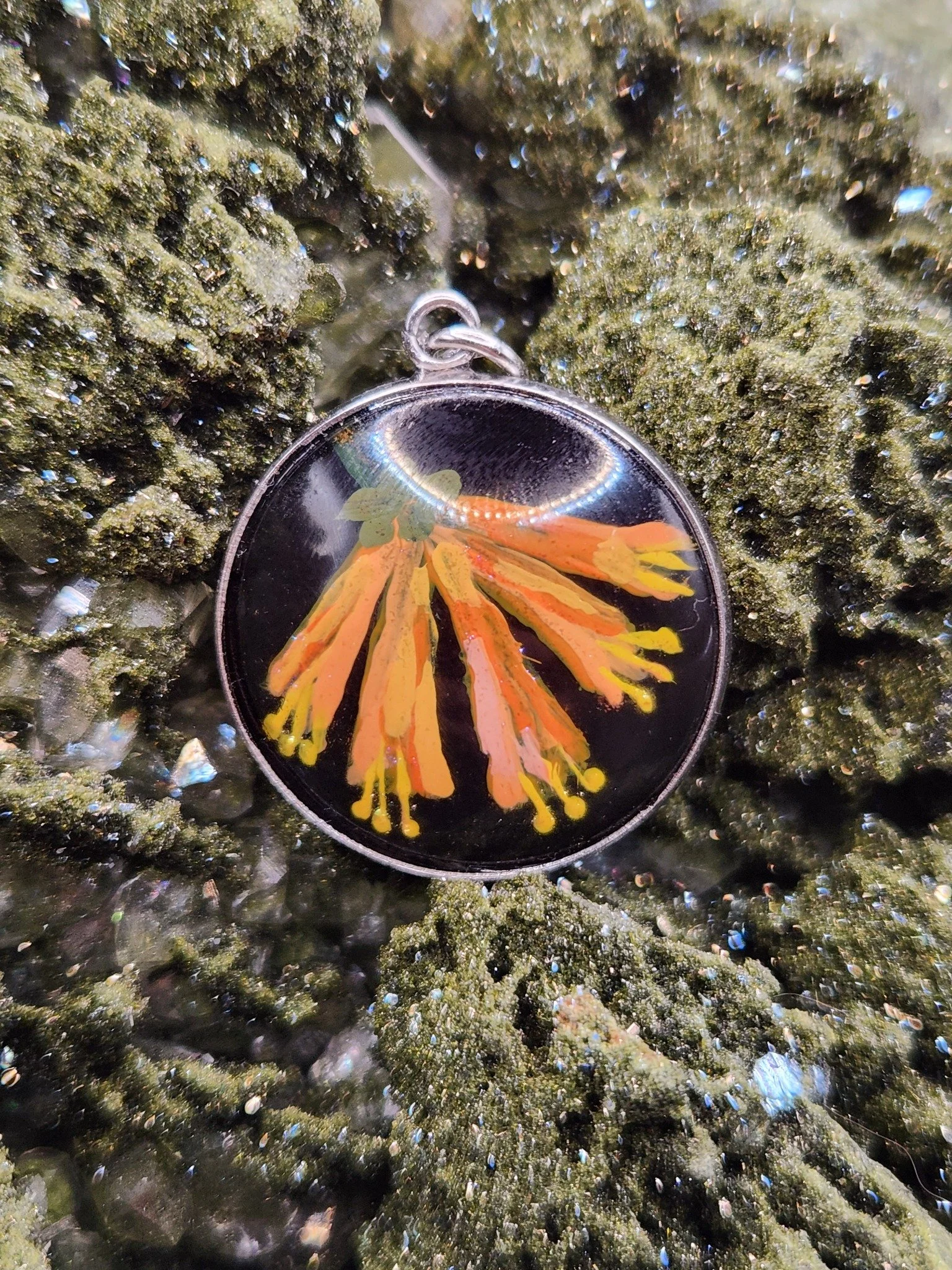 Honeysuckle art pendant displayed on a crystal. Crystal display not included.