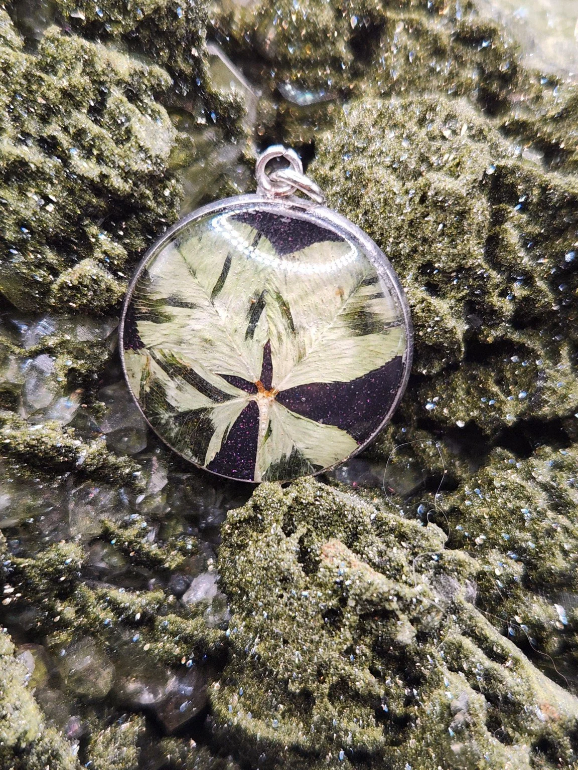 Perfectly Imperfect I001: real clover pendant with purple glitter on a crystal display. Display not included.