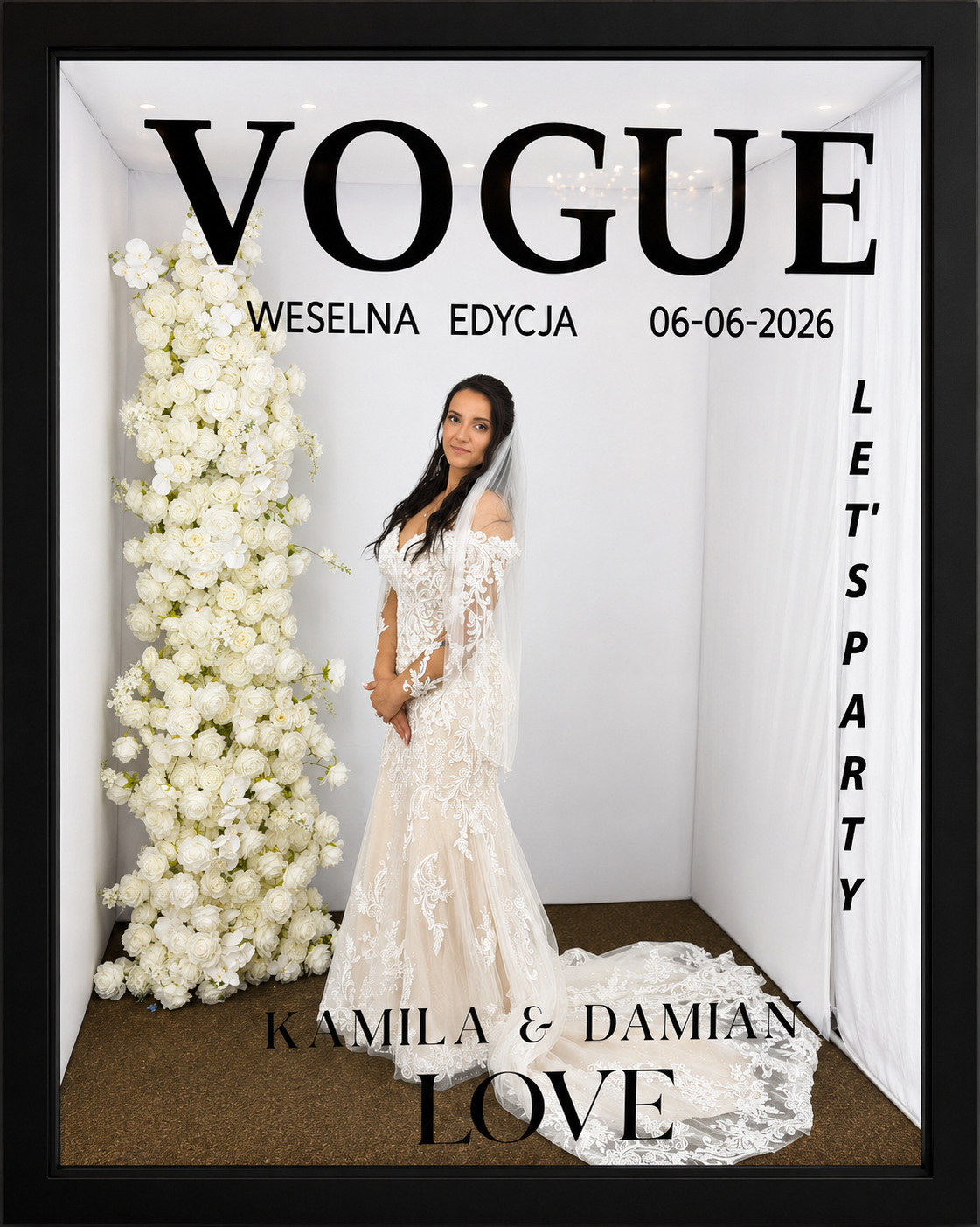 A bride in a white wedding dress with lace detail standing next to a large floral arrangement of white roses and orchids, posing for a photo at a wedding-themed booth with "VOGUE" and other text on the backdrop. Chicago photobooth rental