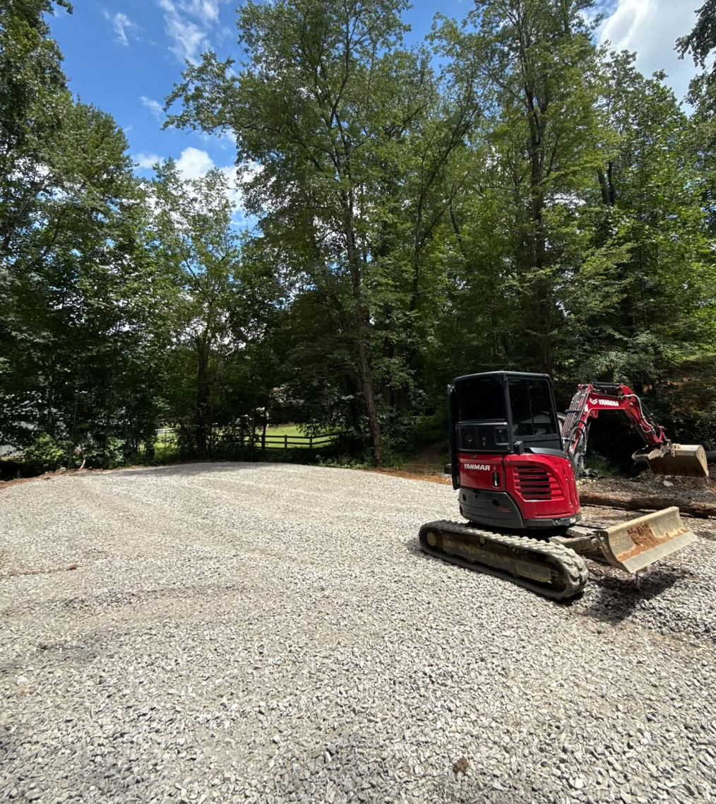 Complete land clearing, forestry mulching, grading, driveway installation, building site preparation, house pad construction, drainage solutions, and excavation project completed by M&S Land Management, proudly serving Asheville, Hendersonville, Gree