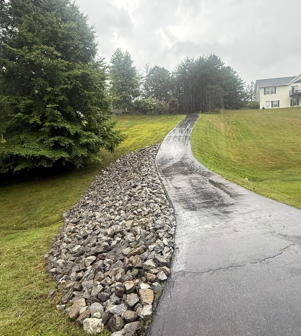 Gravel driveway installation completed in Hendersonville, NC with expert grading and compaction.