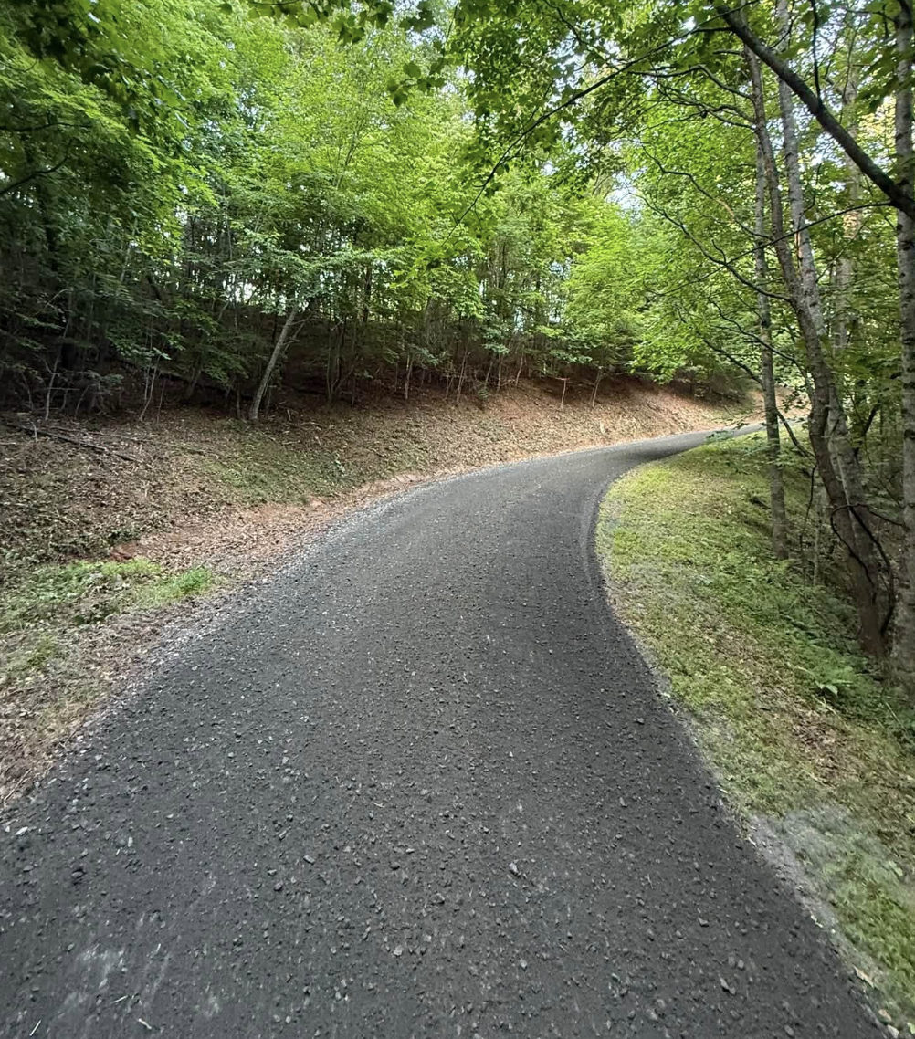 Completed gravel roadway after grading, ditch restoration, and drainage improvements by M&S Land Management.