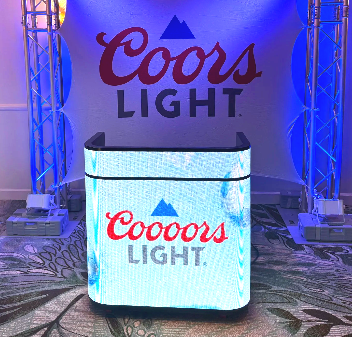 A Coors Light promotional booth with the LED DJ Bar display featuring the Coors Light logo created special for a World Cup campaign. This is within an experiential activation and marketing promotion event.
