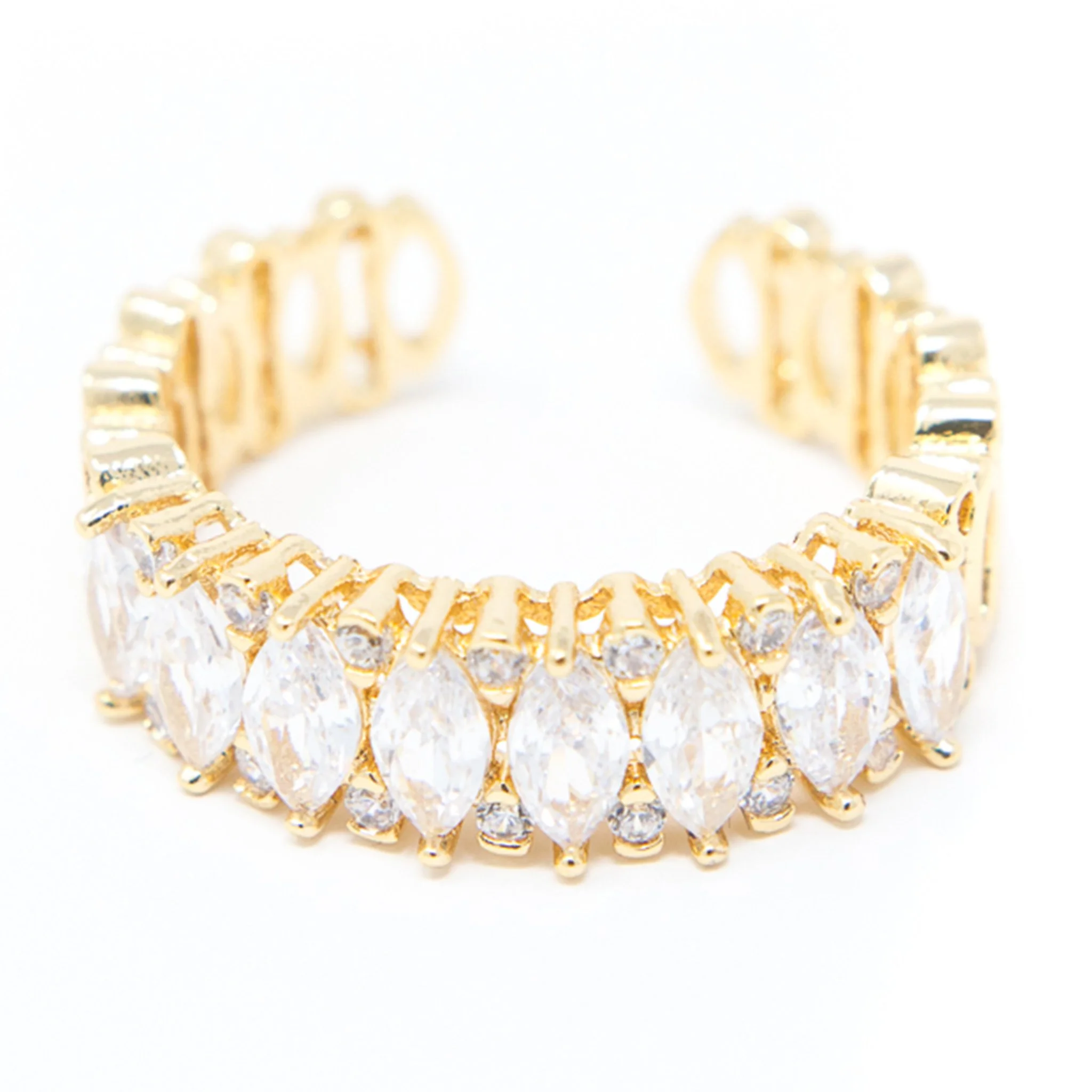 Close-up of gold and silver bracelet with wide links on a white background.