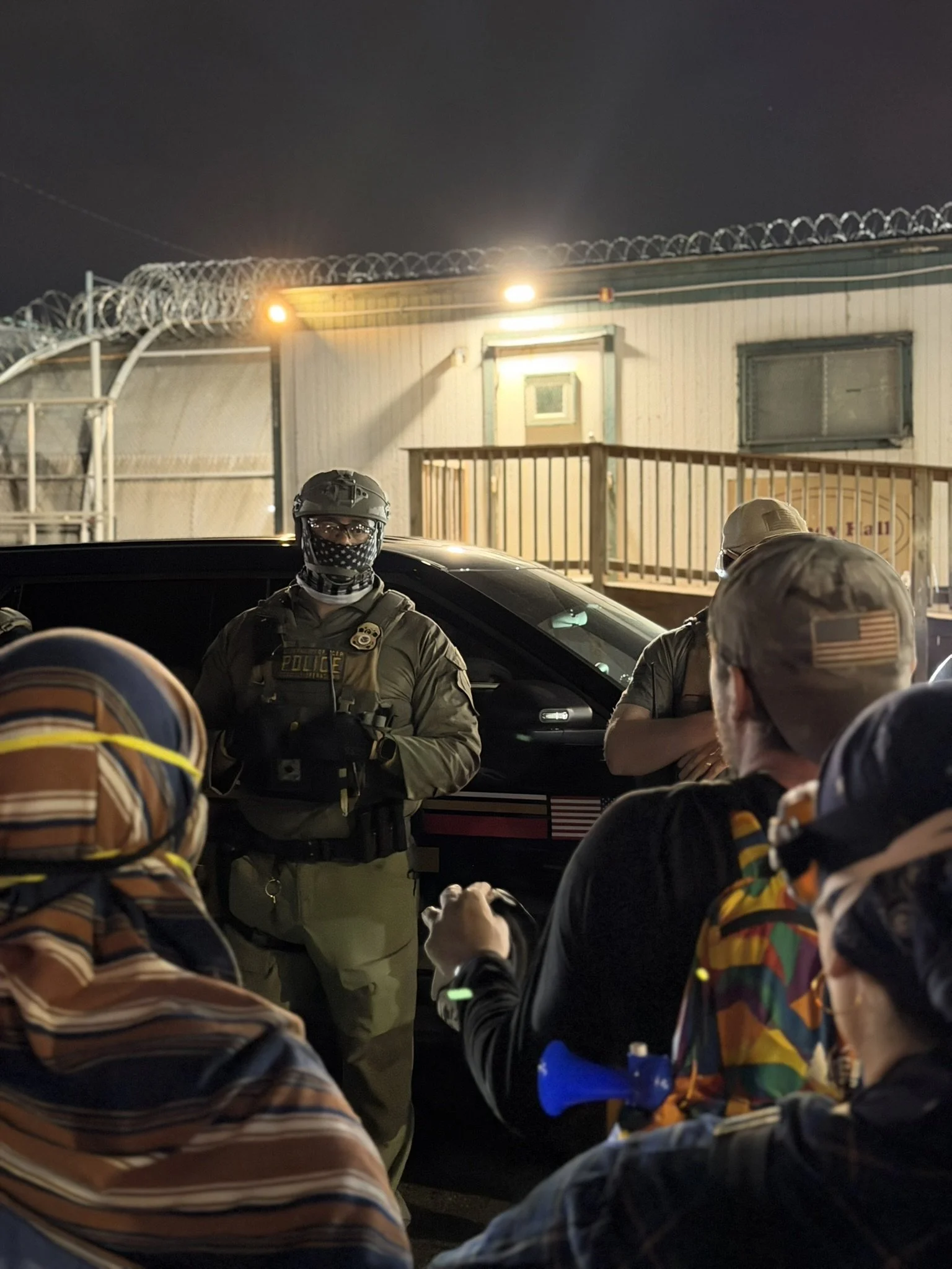 11 Ice Agent as Protester is Speaking.JPEG