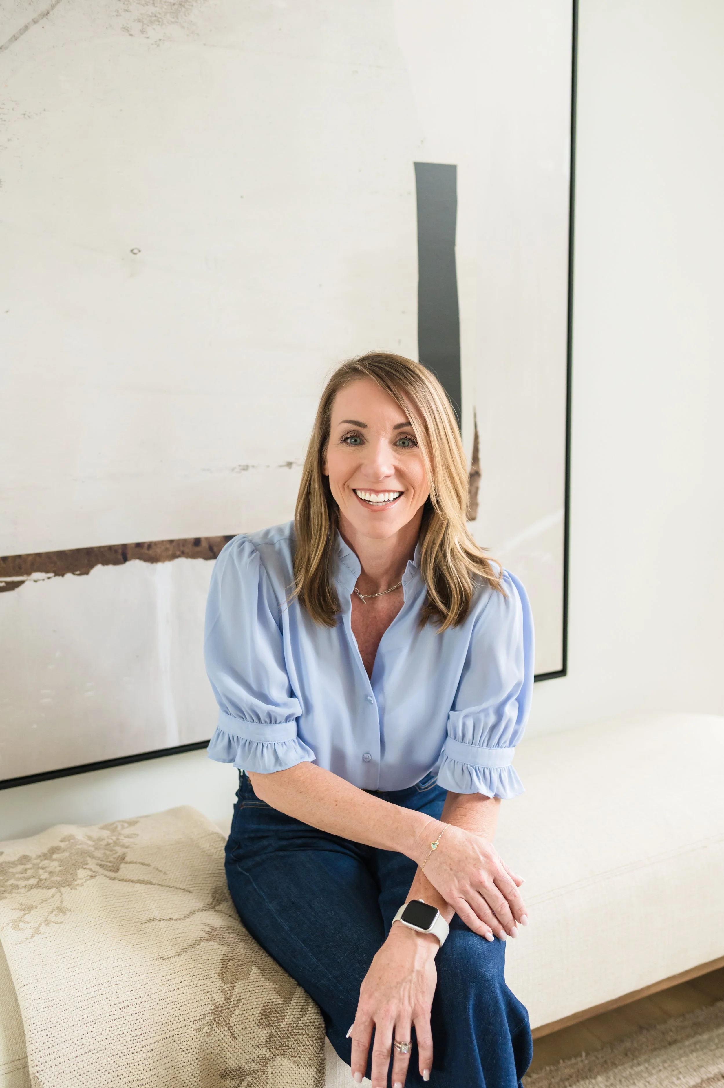 Tiffany Griffin, REALTOR® serving Franklin and Williamson County TN, seated portrait in blue blouse