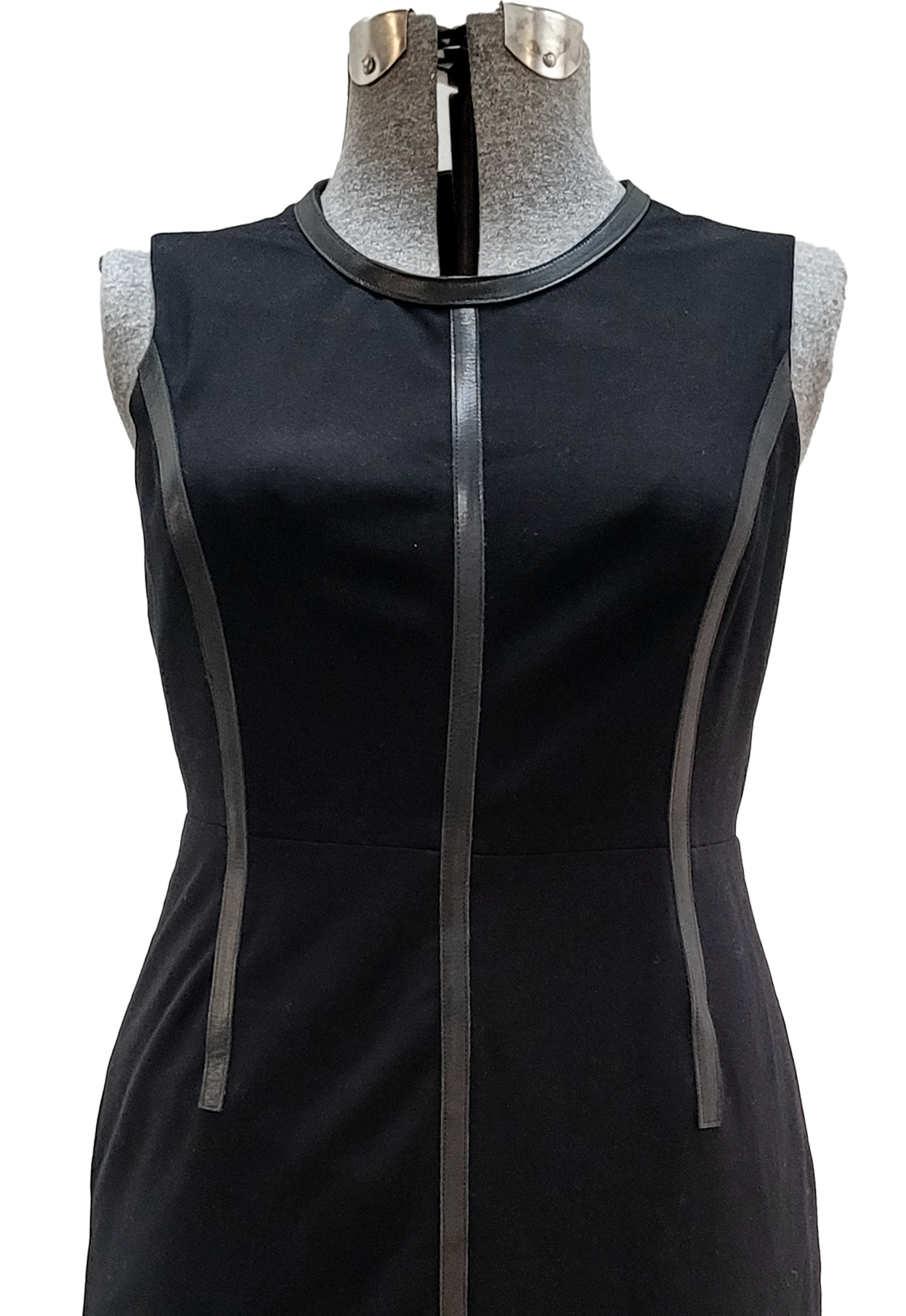 Simple sleeveless black dress on mannequin with leather seaming
