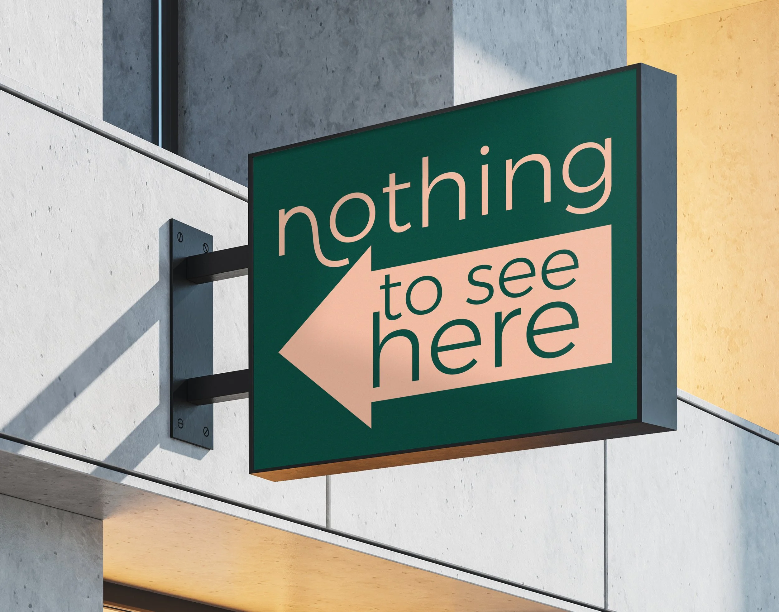 green and peach sign mock up attached to side of concrete building