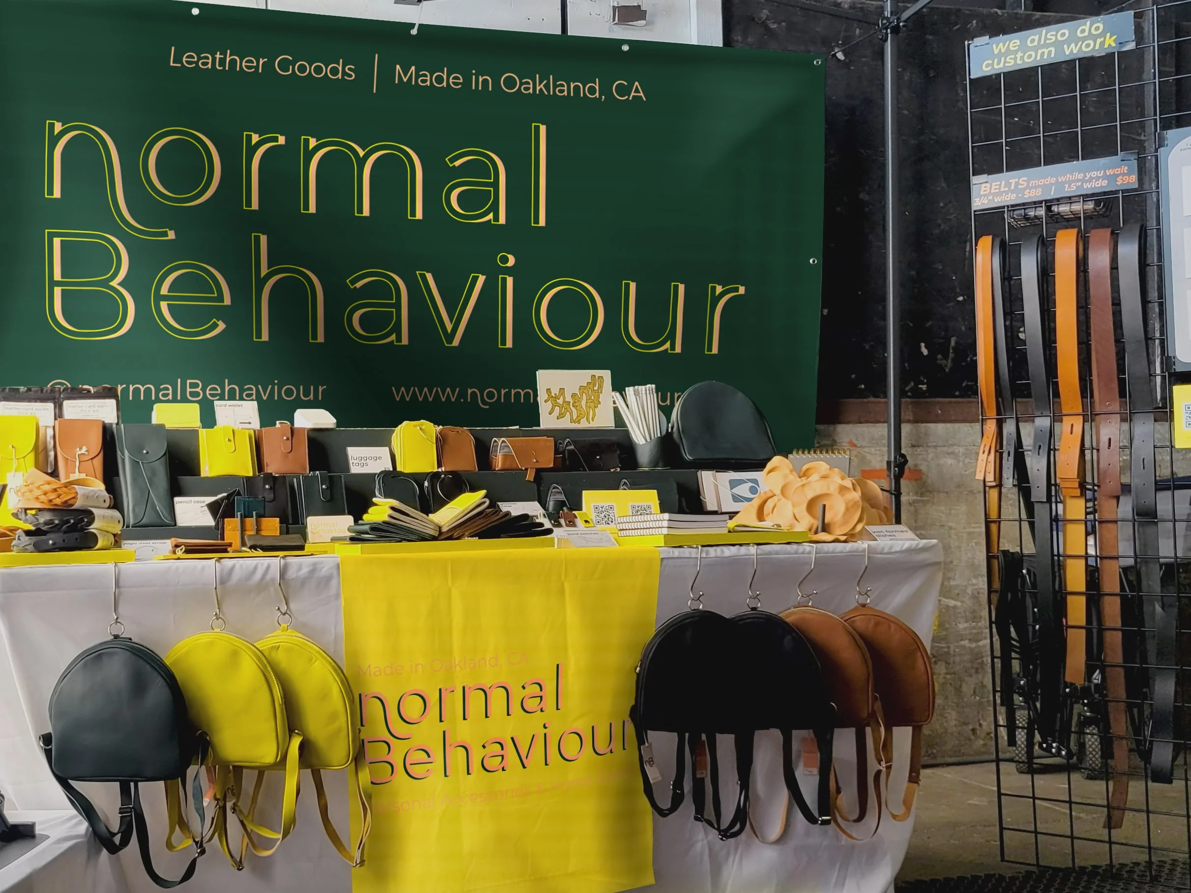 normal Behaviour in-person show display showing products on display on table with business signage