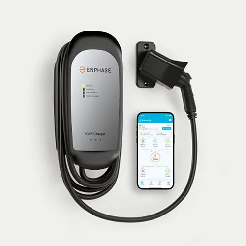 Electric vehicle charging station with a connected smartphone displaying the charging app.