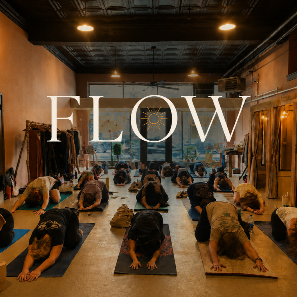 People participating in a yoga class in a studio with the word 'FLOW' overlaid.
