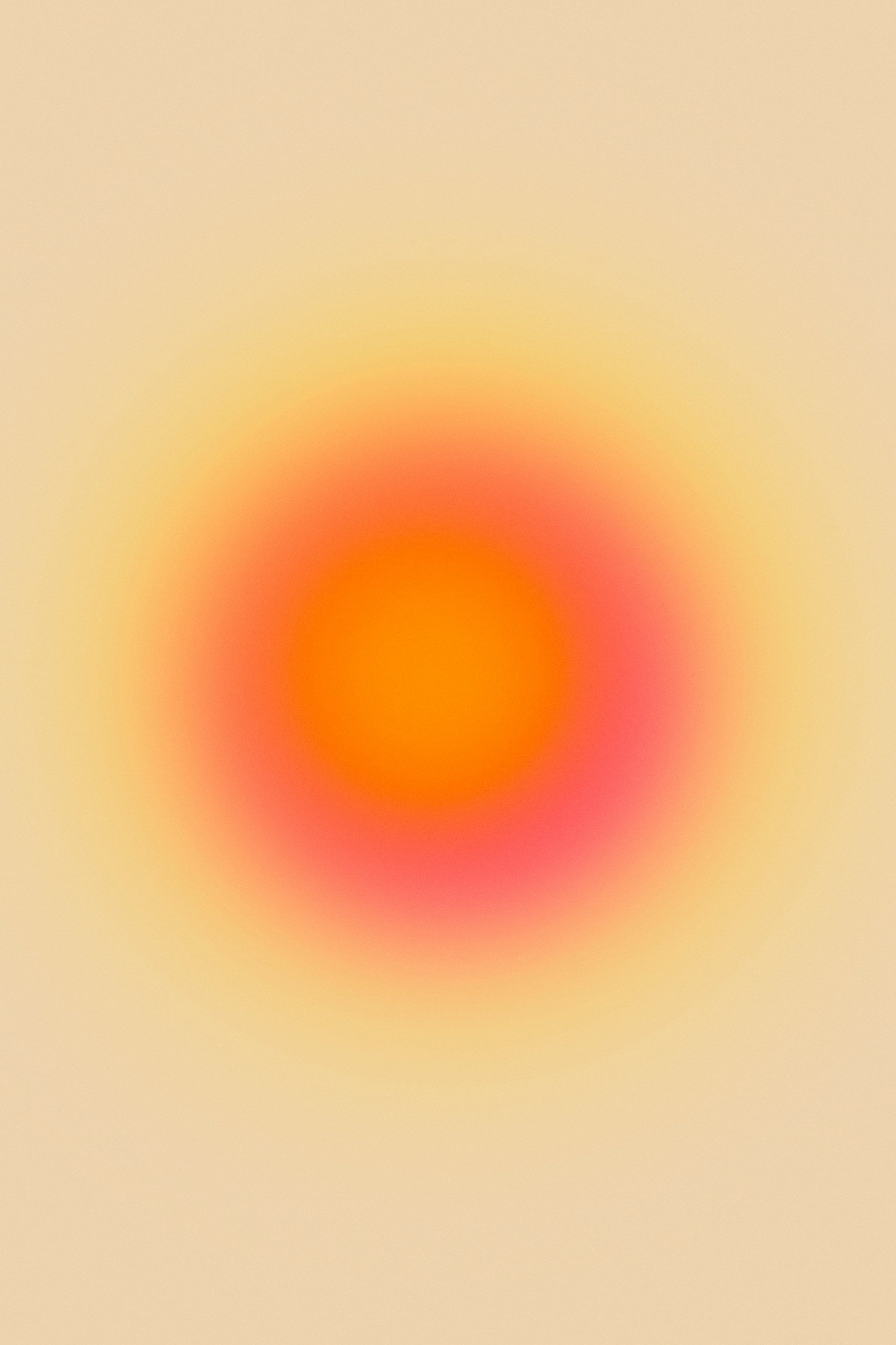 Blurred abstract image with warm colors, predominantly orange, pink, yellow, and beige.