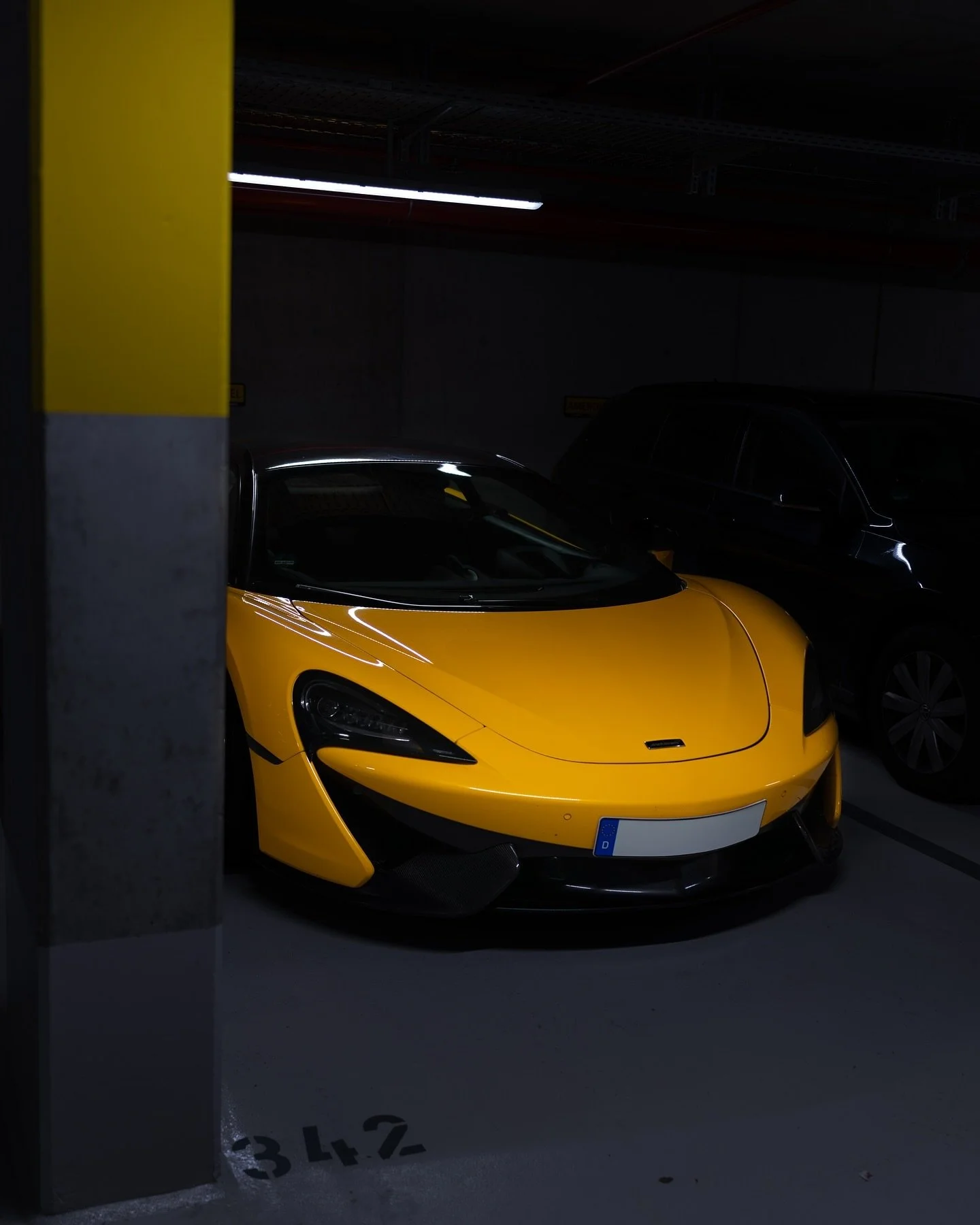Yellow, fierce, and ready ⚡️ &ndash; the McLaren 570S in all its glory. Shadows and light dance on its curves as it waits in the garage for the next adrenaline rush. 
__________________________

#McLaren570S #YellowBeast #SupercarVibes #CarLovers #Dr