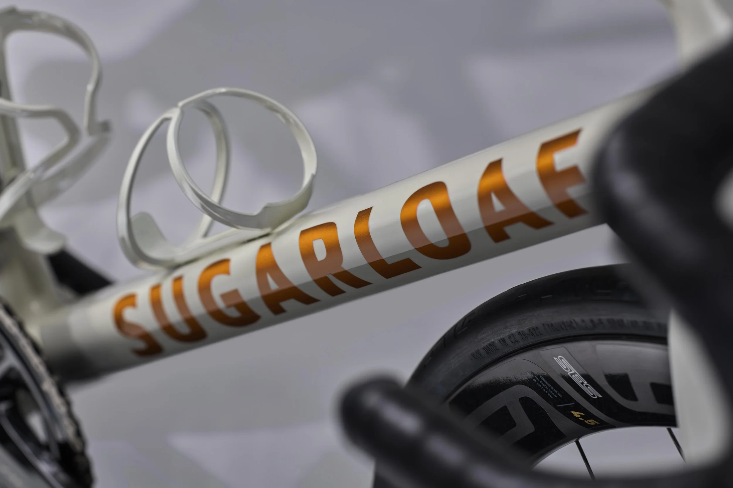 beautiful painted bicycle logo in copper