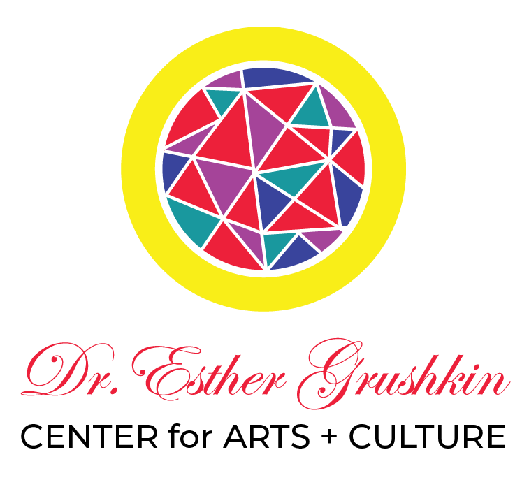 A colorful logo featuring a circular geometric pattern with triangles inside a yellow border. Below the pattern, the text "Dr. Esther Grushkin" is written in red cursive.