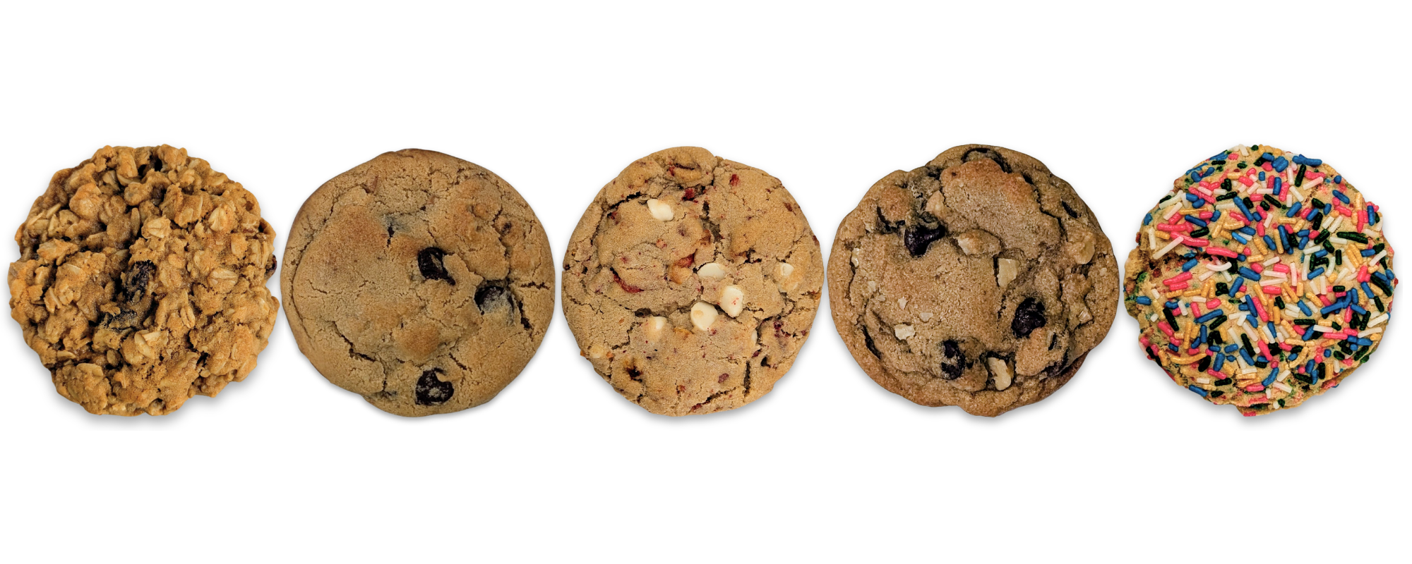 Five cookies lined up, seen from overhead, featuring the following flavors: oatmeal raisin, chocolate chip, white chocolate and strawberry, chocolate chip and walnut, and rainbow sprinkles