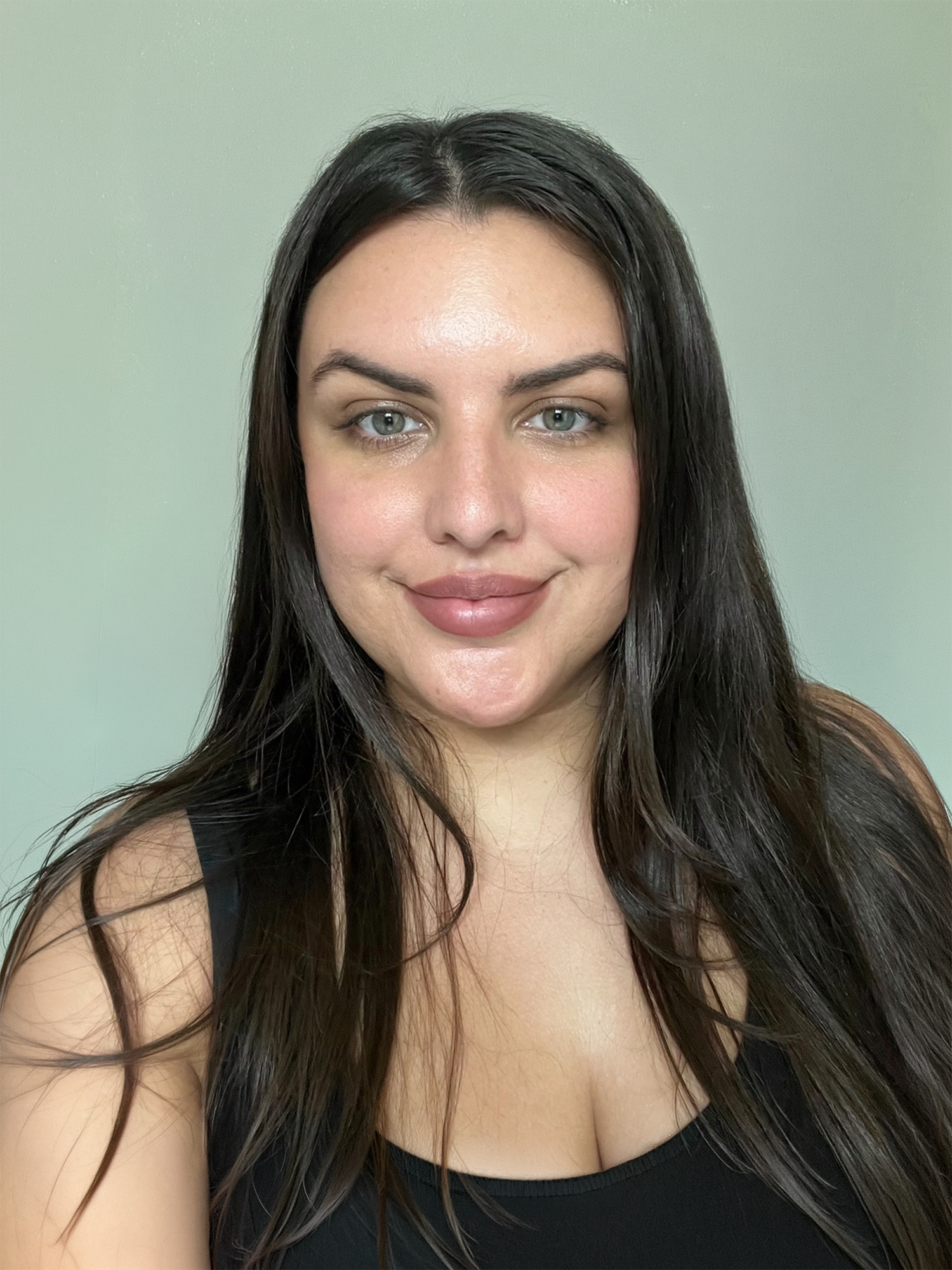 A portrait of Sara, a lash artist.