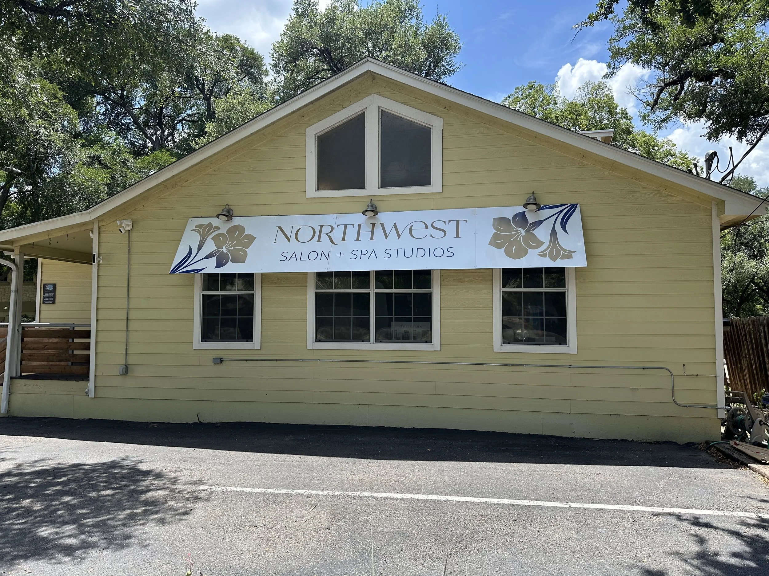 Northwest Salon & Spa Studios banner on the side of the business.