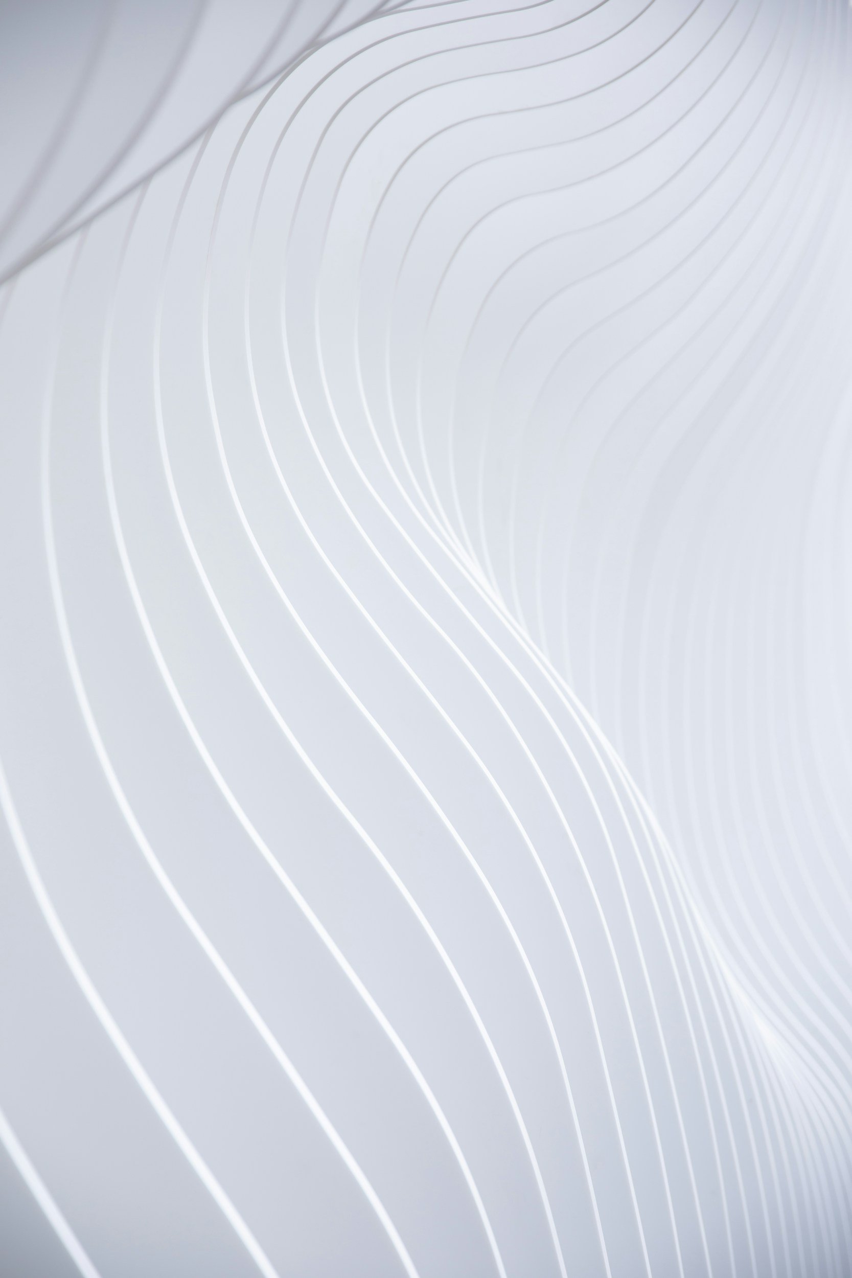 Abstract background with flowing white lines on a light gradient background.