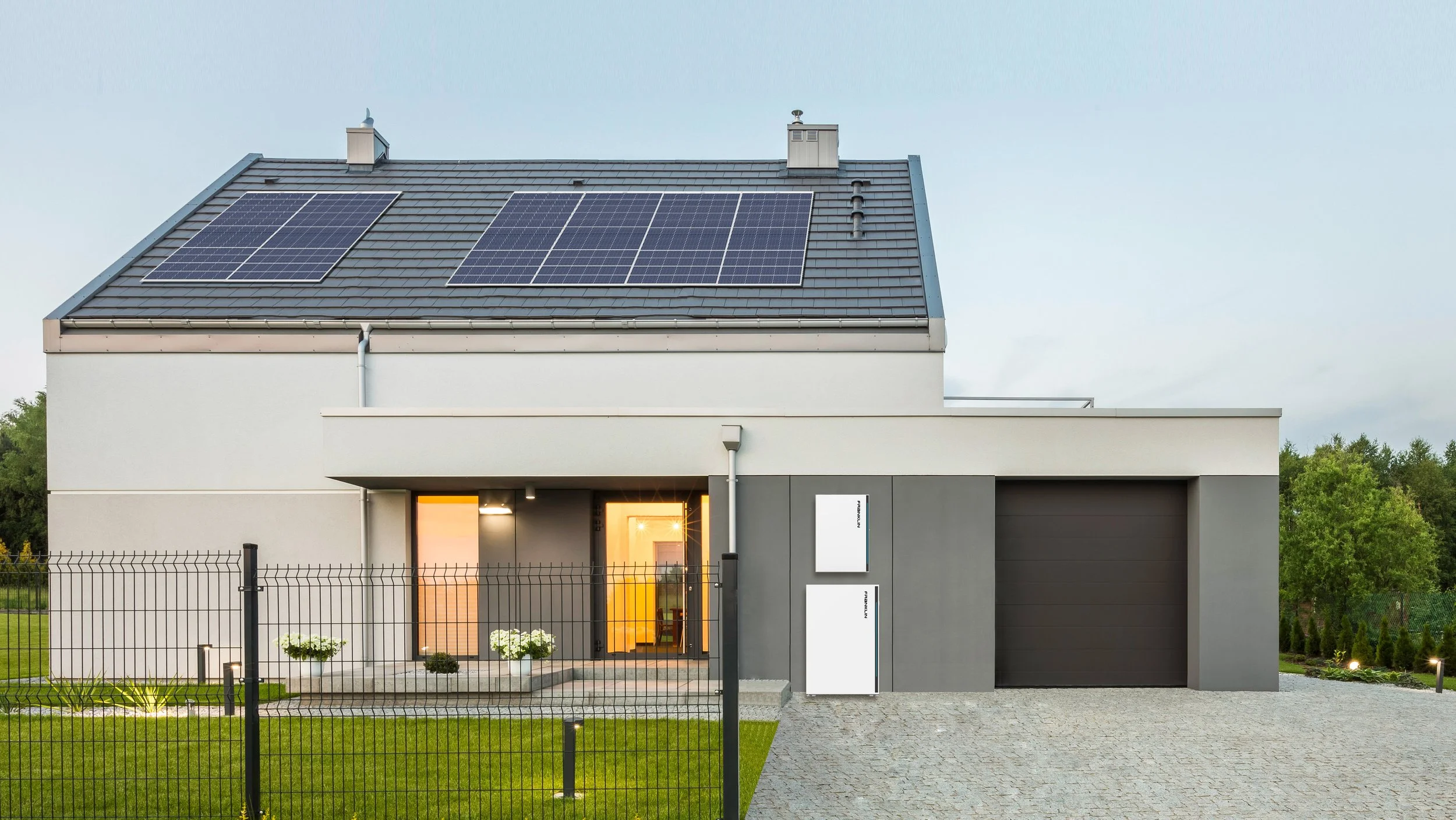 Home with solar panels on the roof and ESS battery energy storage system for backup power