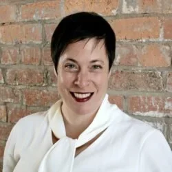 Woman with short brown hair and red lipstick