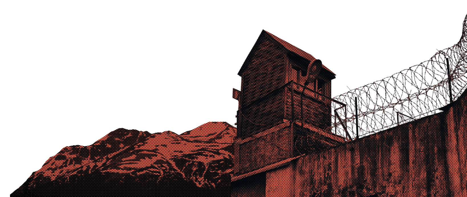 Prison building with mountains in the background