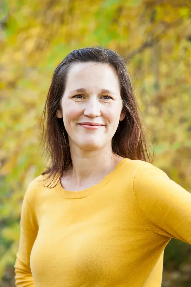 smiling woman in a yellow shirt