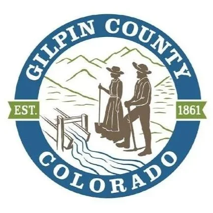 Logo of Gilpin County, Colorado featuring two historic figures in front of mountain scenery and a watermill, with the text 'Gilpin County Colorado' and 'Est. 1861'.