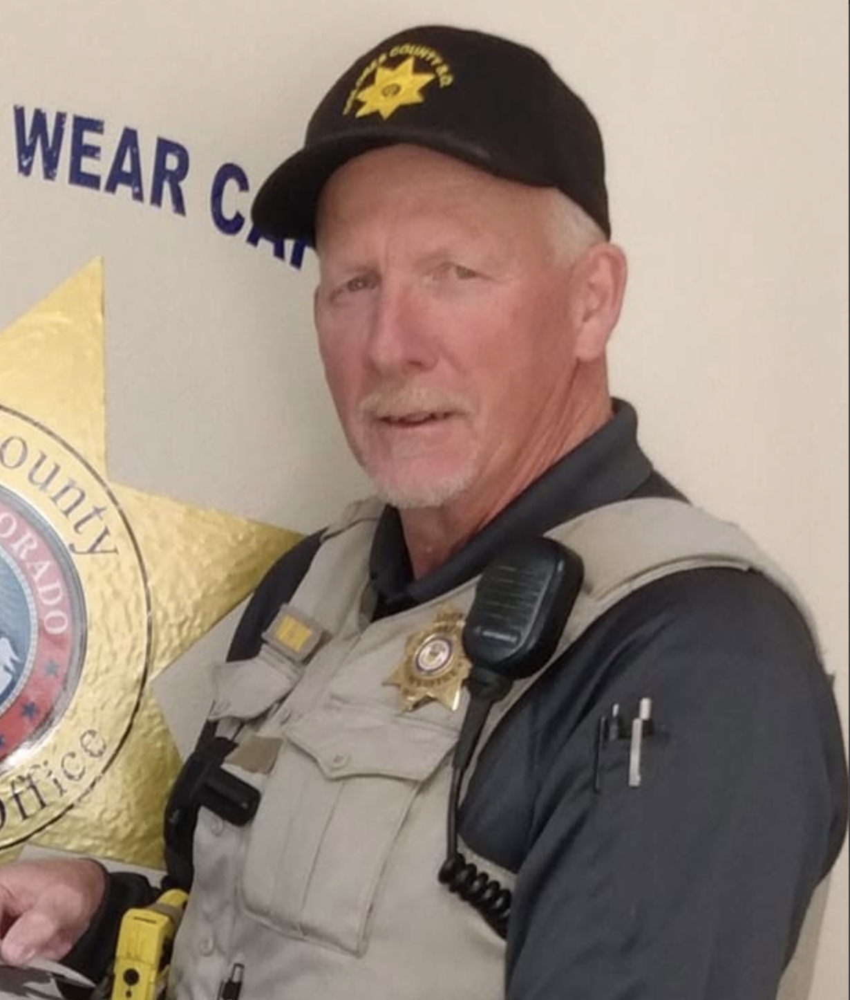 sheriff in tactical vest and cap