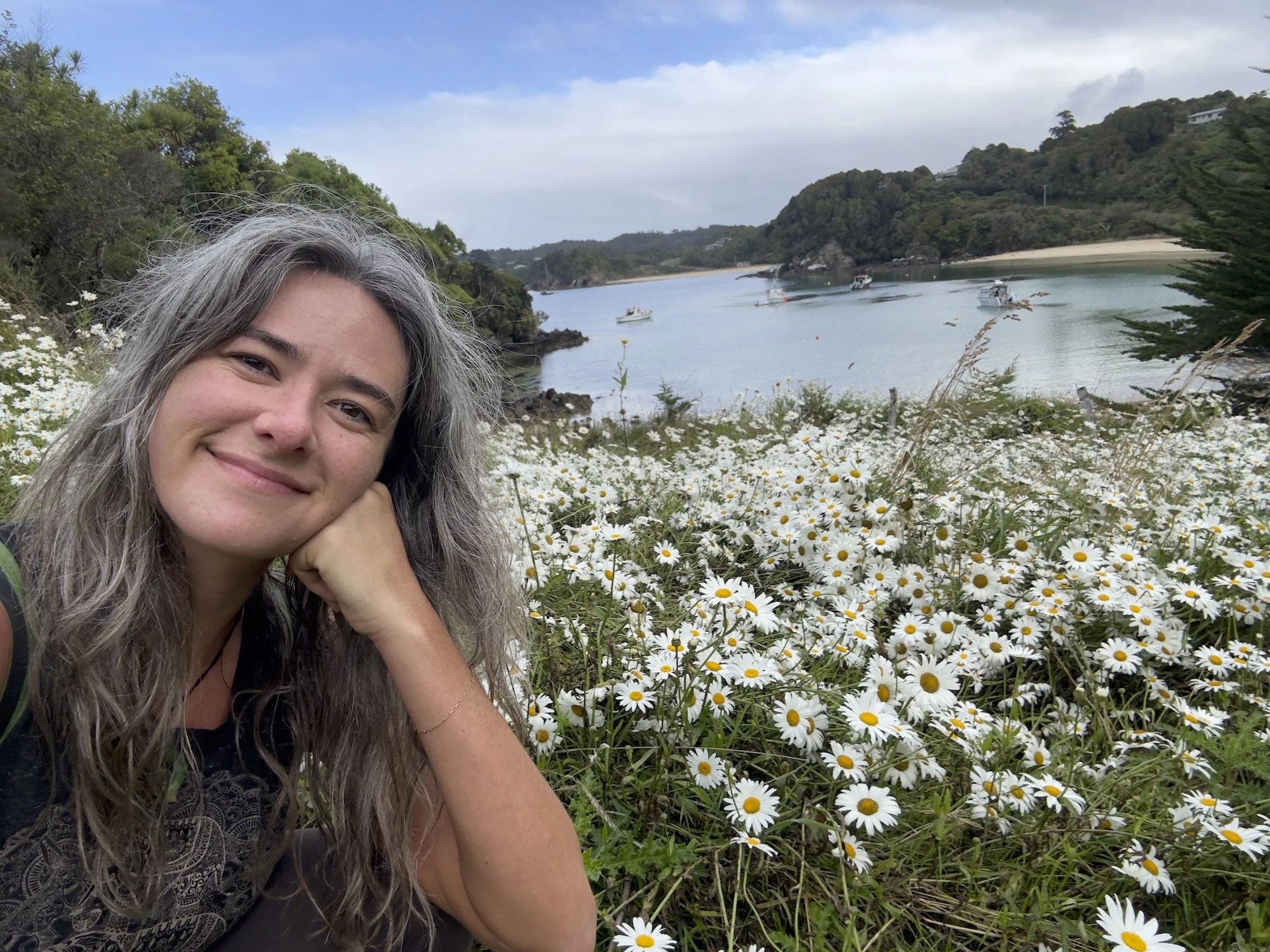 Woman smiling in field of flowers