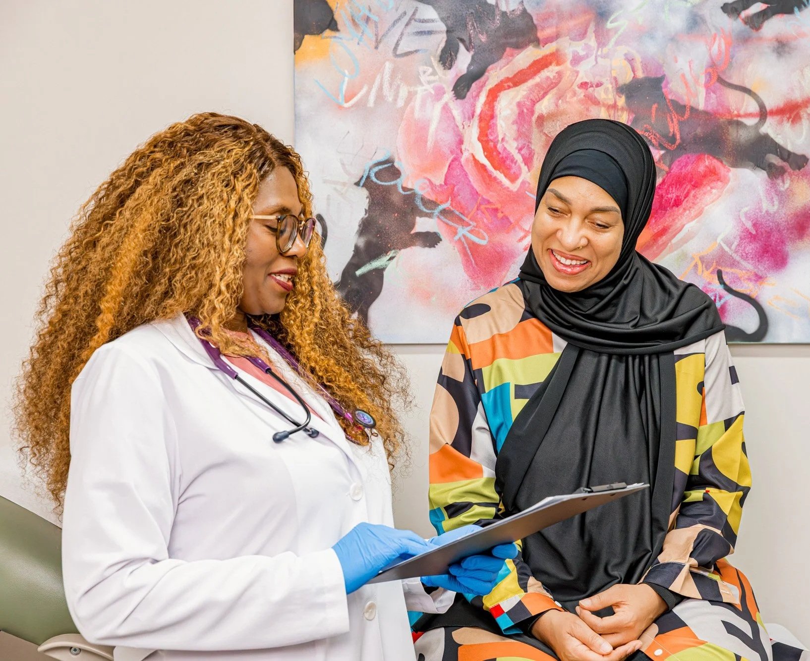 Dr. Bella speaking with a patient