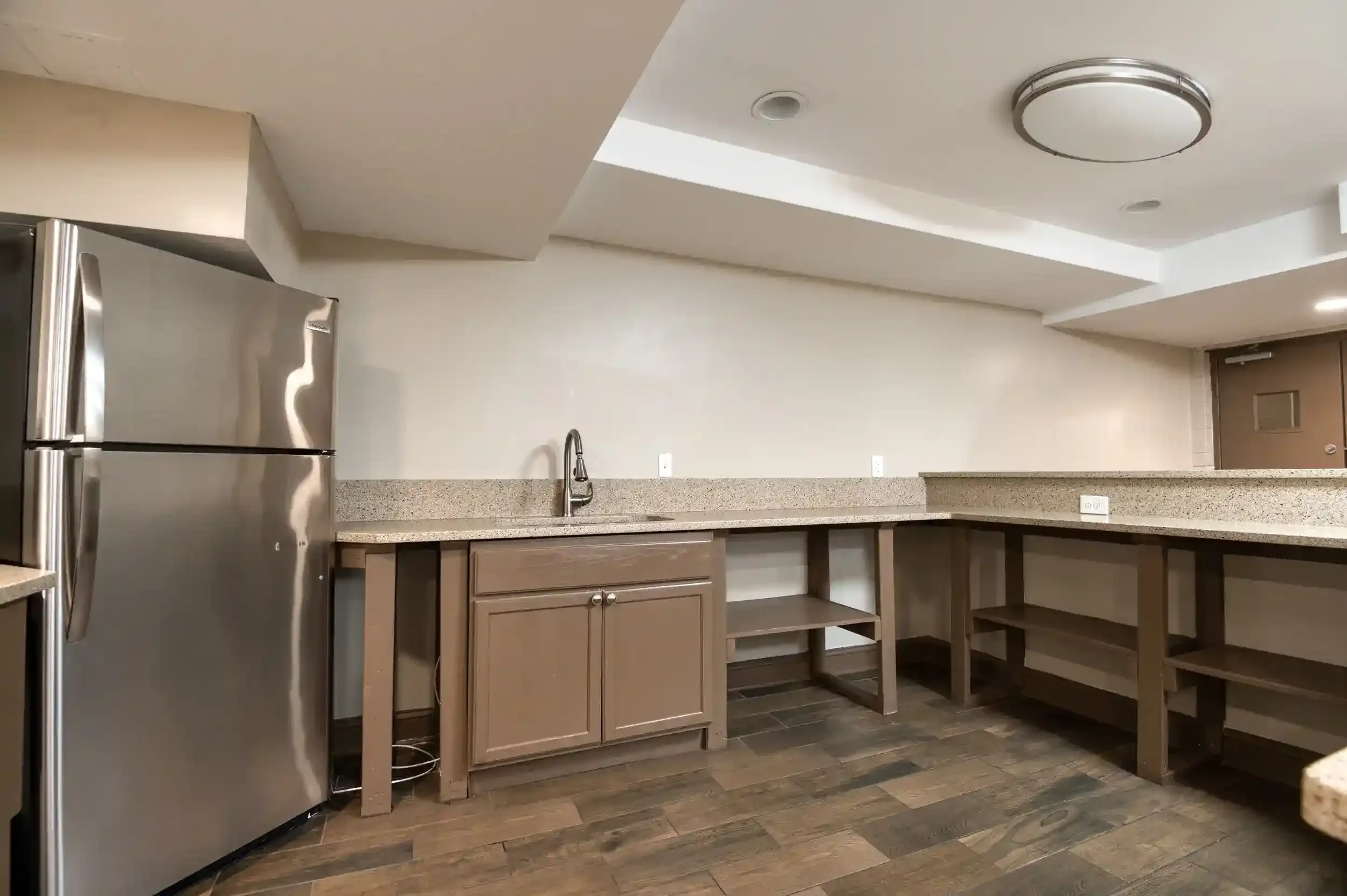 Party Room Kitchen Area – Includes a kitchenette with a full fridge and prep counter for easy event hosting.