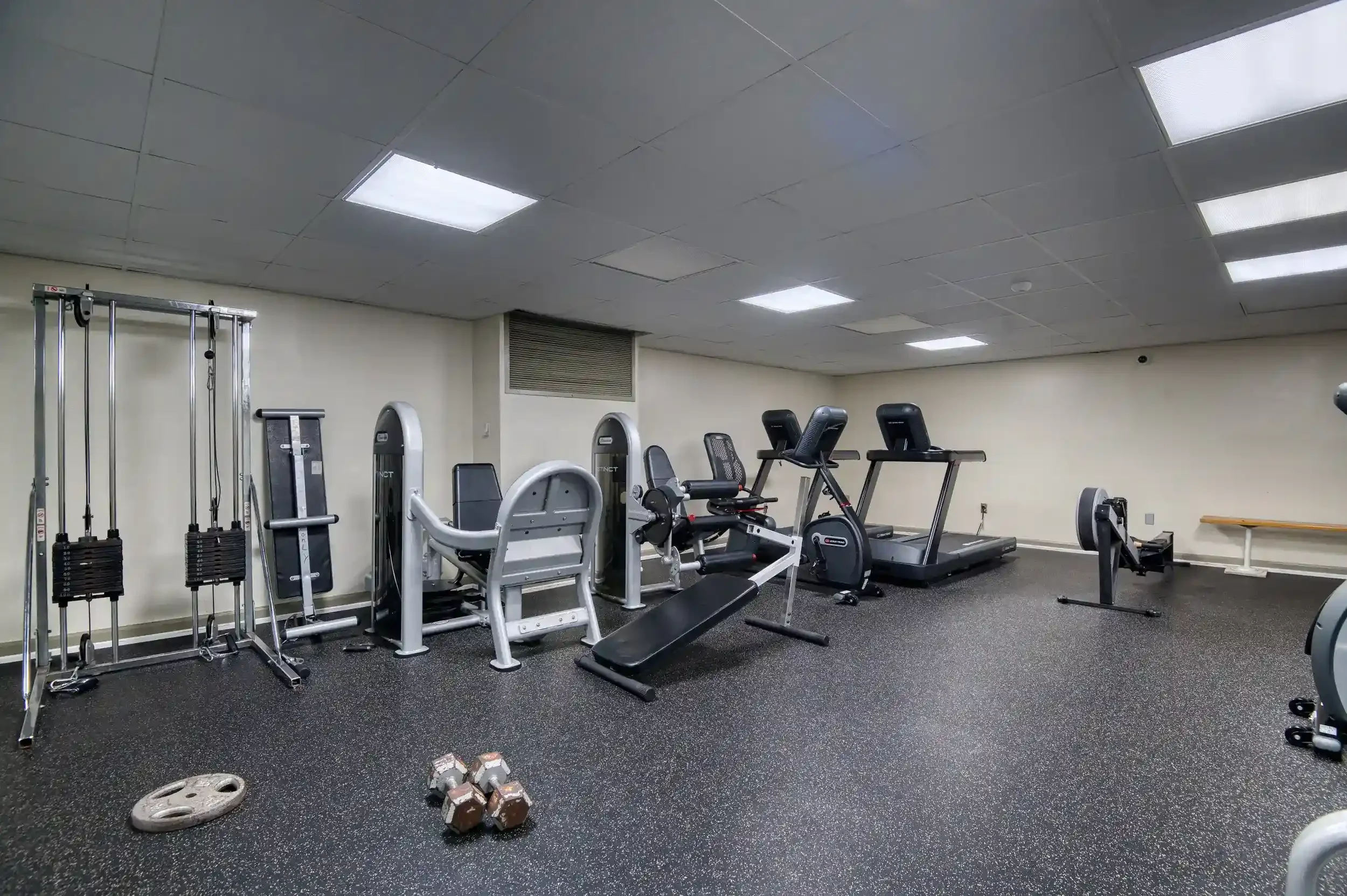 Fitness Room (View 1) – The Carlyn’s fitness room is equipped with both strength and cardio equipment for convenient workouts.