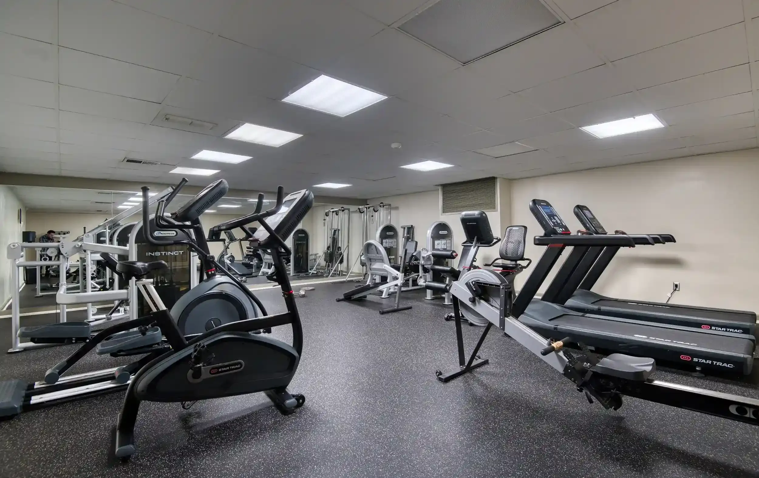 Fitness Room (View 2) – Treadmills, ellipticals, and bikes offer residents a variety of cardio options without leaving the building.