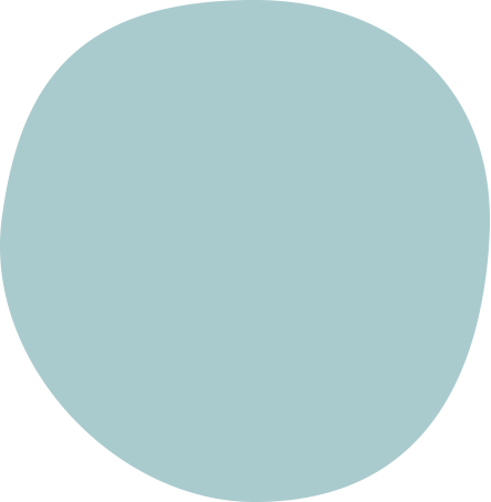 A teal-colored measuring cup with a handle and measurements marked on the side.