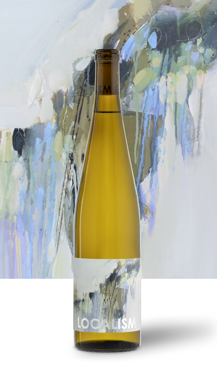 A yellow wine bottle with a label that reads 'LOCALISM', set against an abstract, colorful painting background.