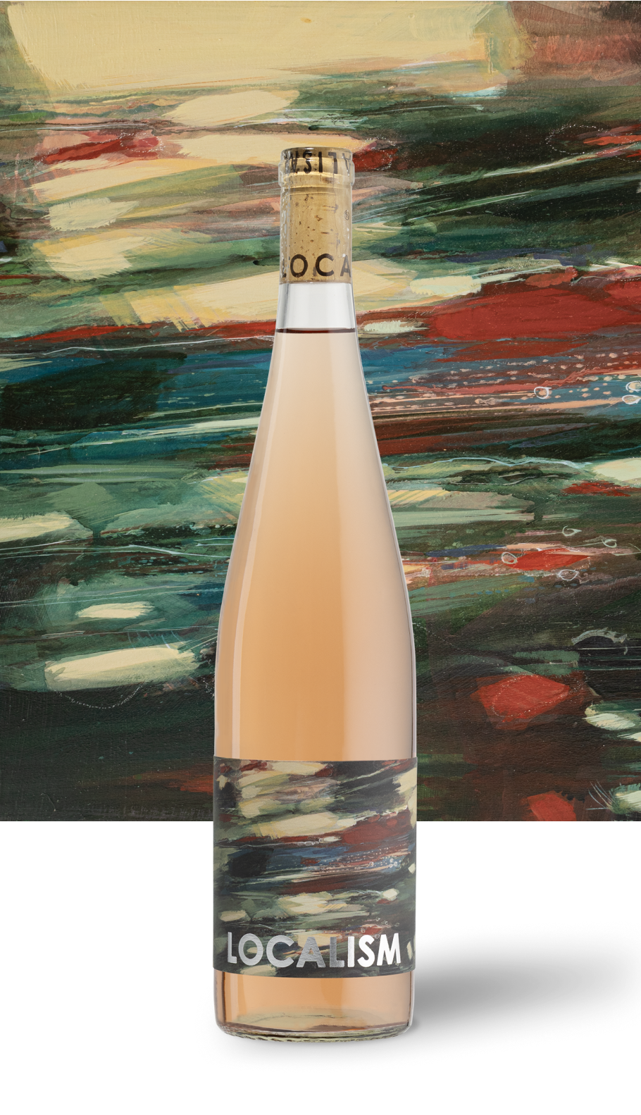 A tall, slim bottle with a beige liquid inside, labeled 'LOCALISM,' standing in front of an abstract, colorful painted background.