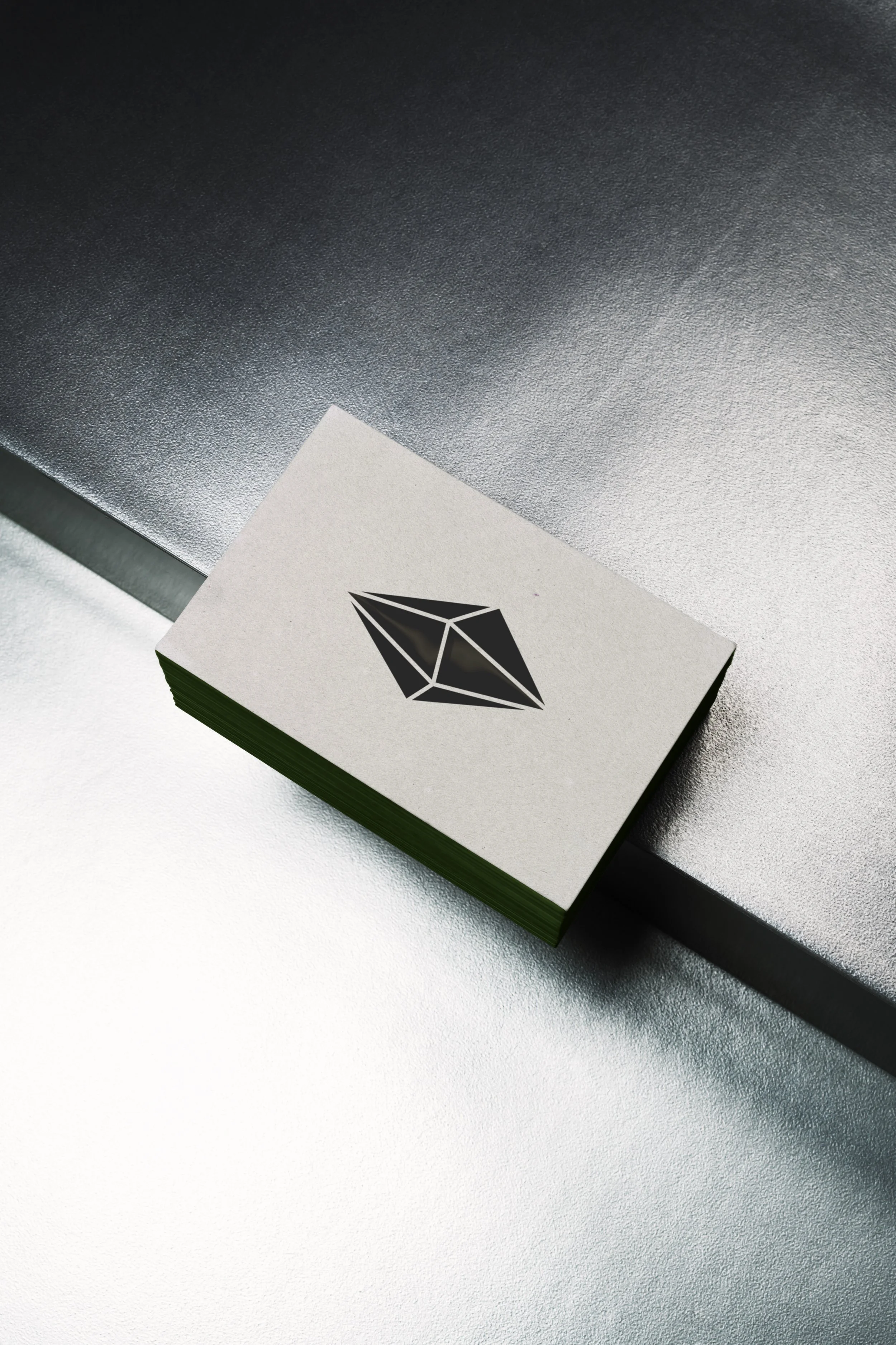 Close-up of a white card featuring an abstract black geometric design.