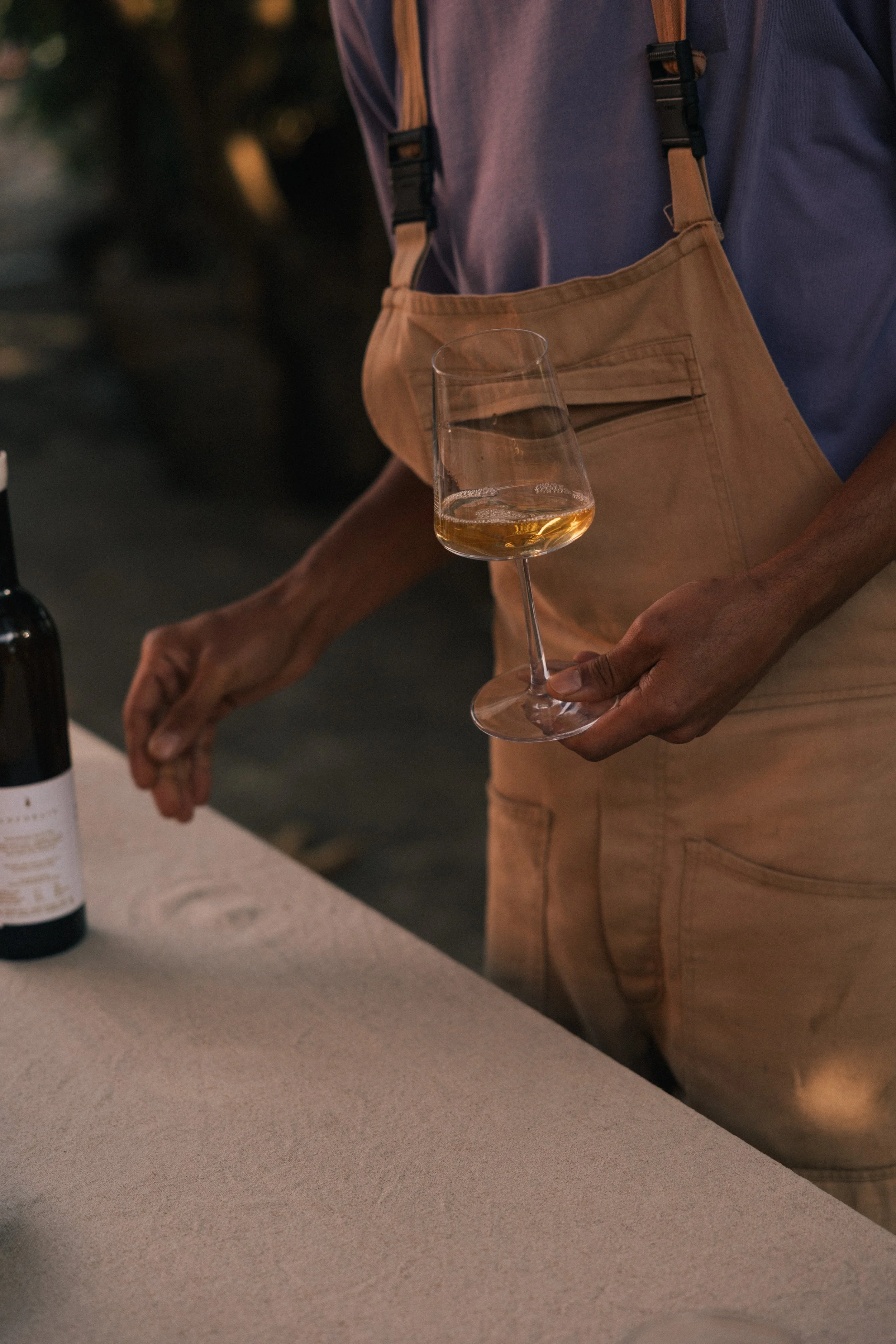 Jacopo talking about wine and holding Anforaje withe wine