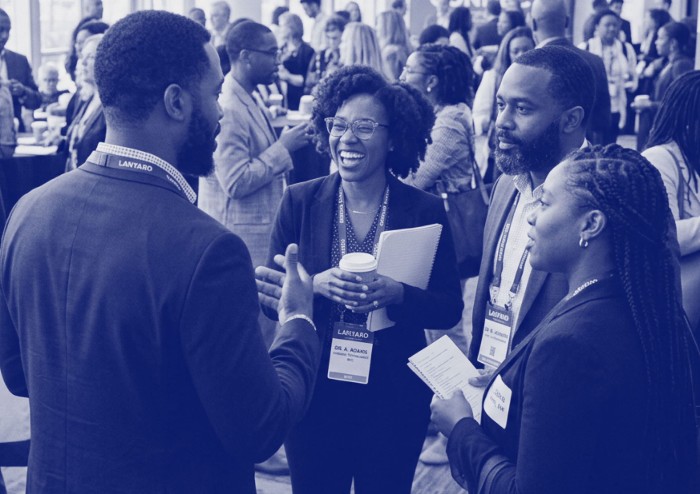 A group of mental health professionals attending a conference or networking event, engaging in conversations and exchanging information.